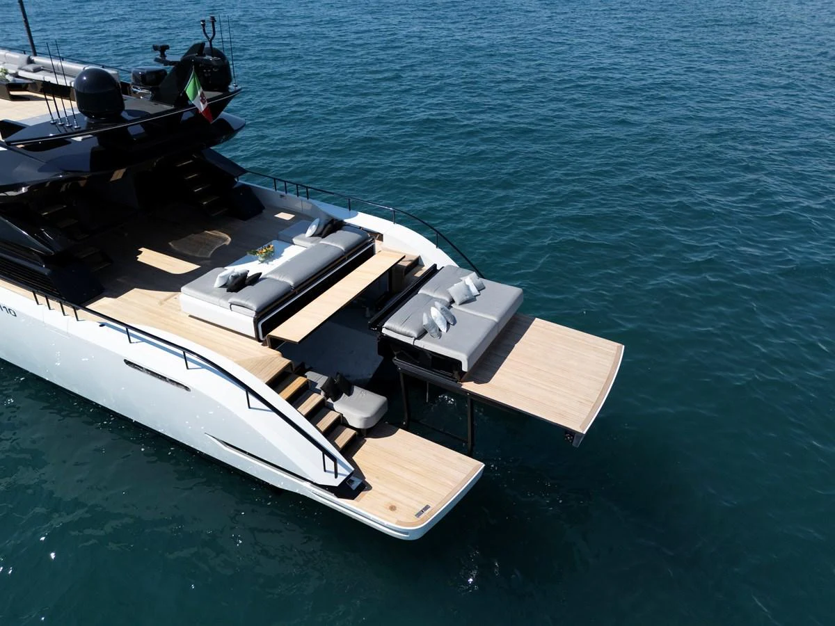 The yacht's aft deck features a luxurious lounging area with direct access to the water. aboard AB 110 Yacht for Sale