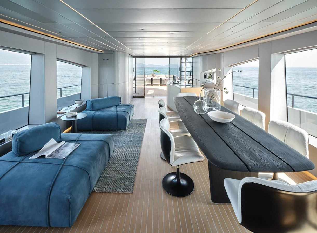 The spacious and modern interior features a stylish dining area and comfortable lounging space with panoramic ocean views. aboard AB 110 Yacht for Sale