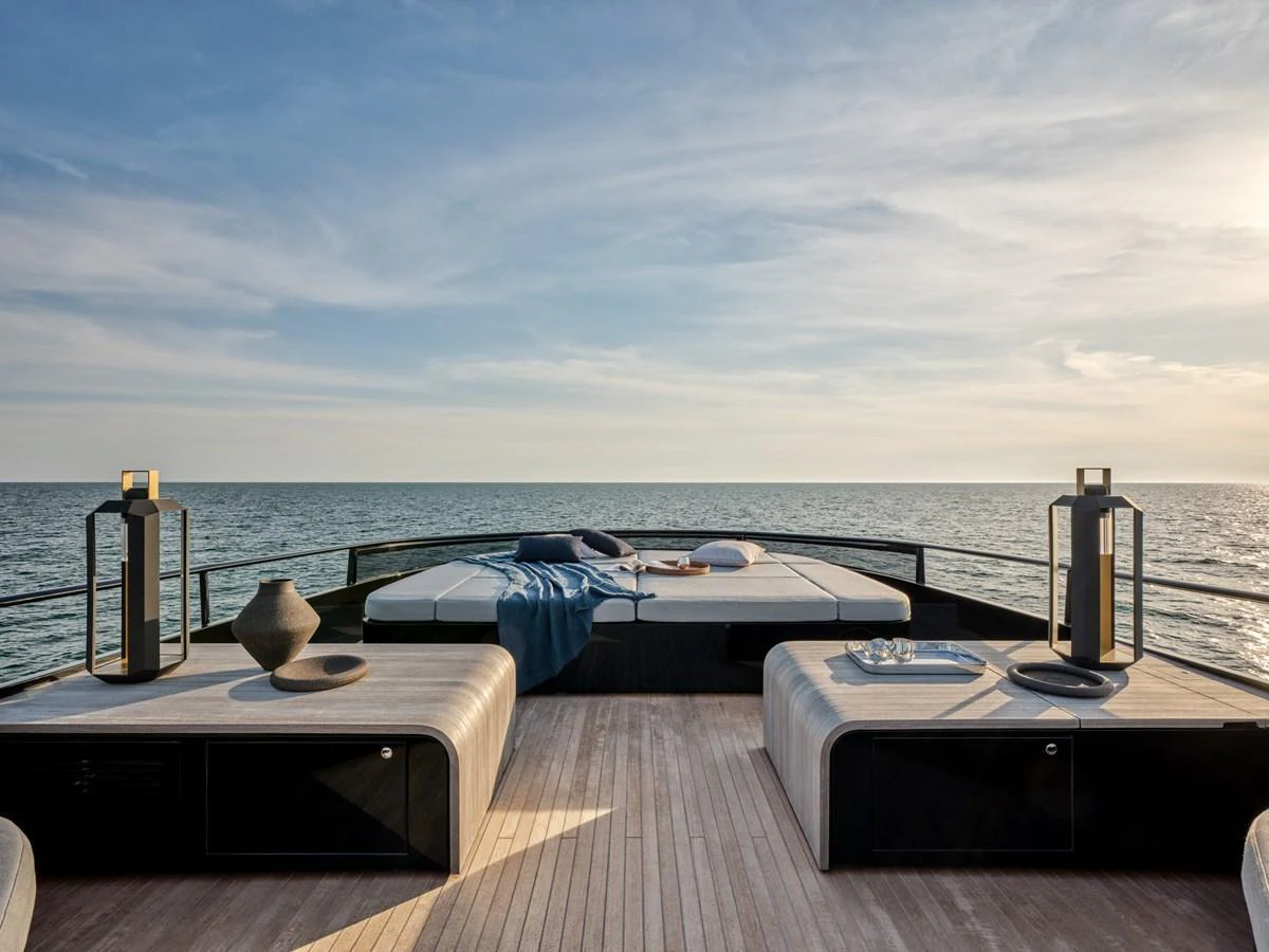 The sundeck offers a serene space with luxurious sunbeds and a stunning ocean view. aboard AB 110 Yacht for Sale