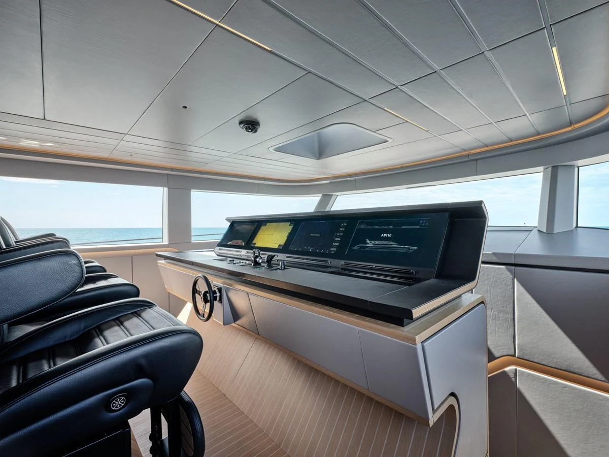 The helm station offers a sleek and modern design with panoramic views of the sea. aboard AB 110 Yacht for Sale