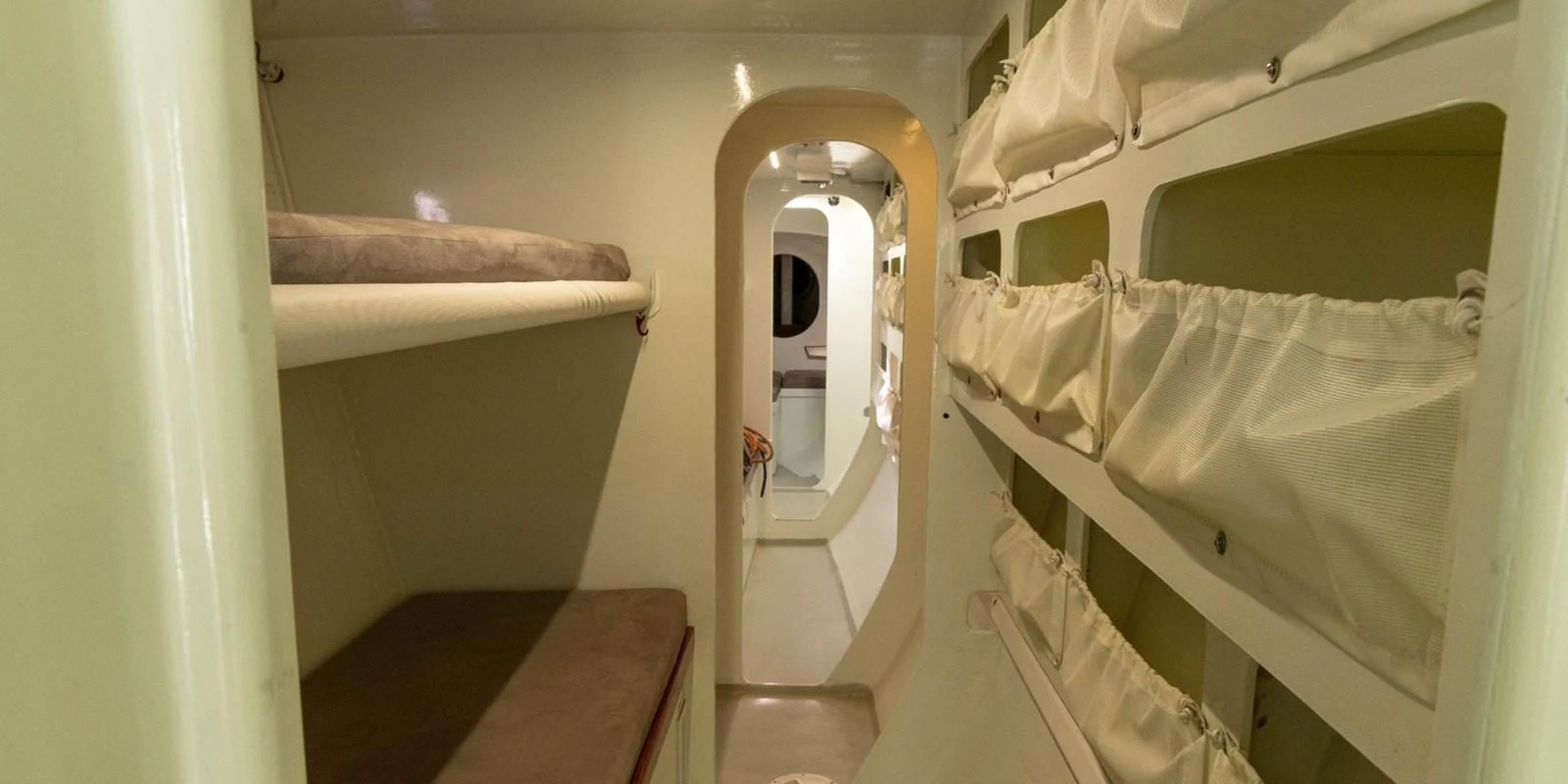 The image showcases the compact and functional crew quarters of the yacht. aboard MAXICAT VICTORIA Yacht for Sale