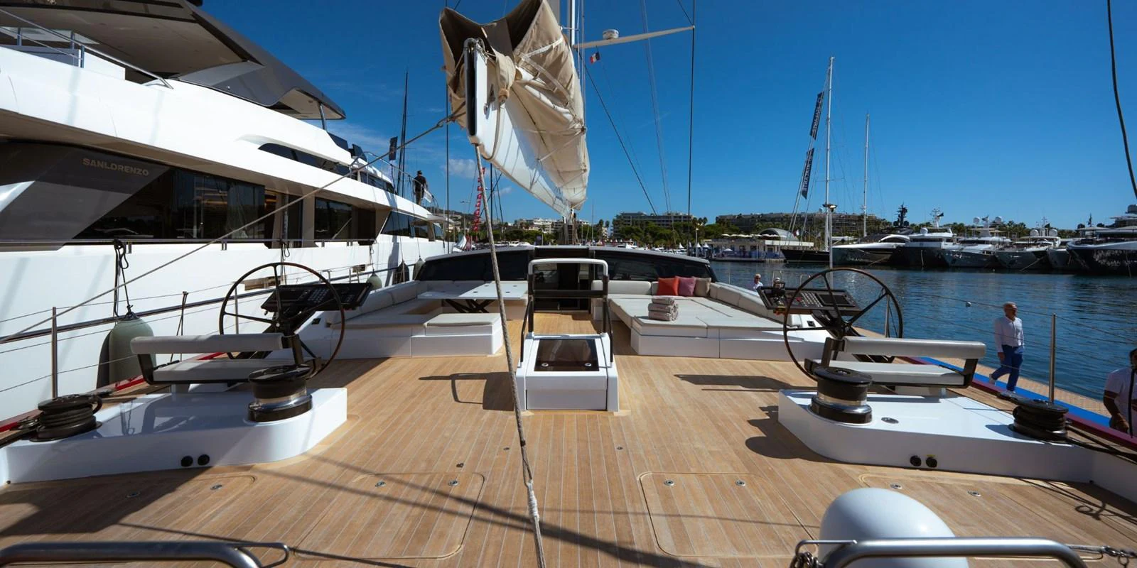 The spacious aft deck features dual helm stations and ample seating, perfect for outdoor relaxation and navigation. aboard NOMAD IV Yacht for Sale