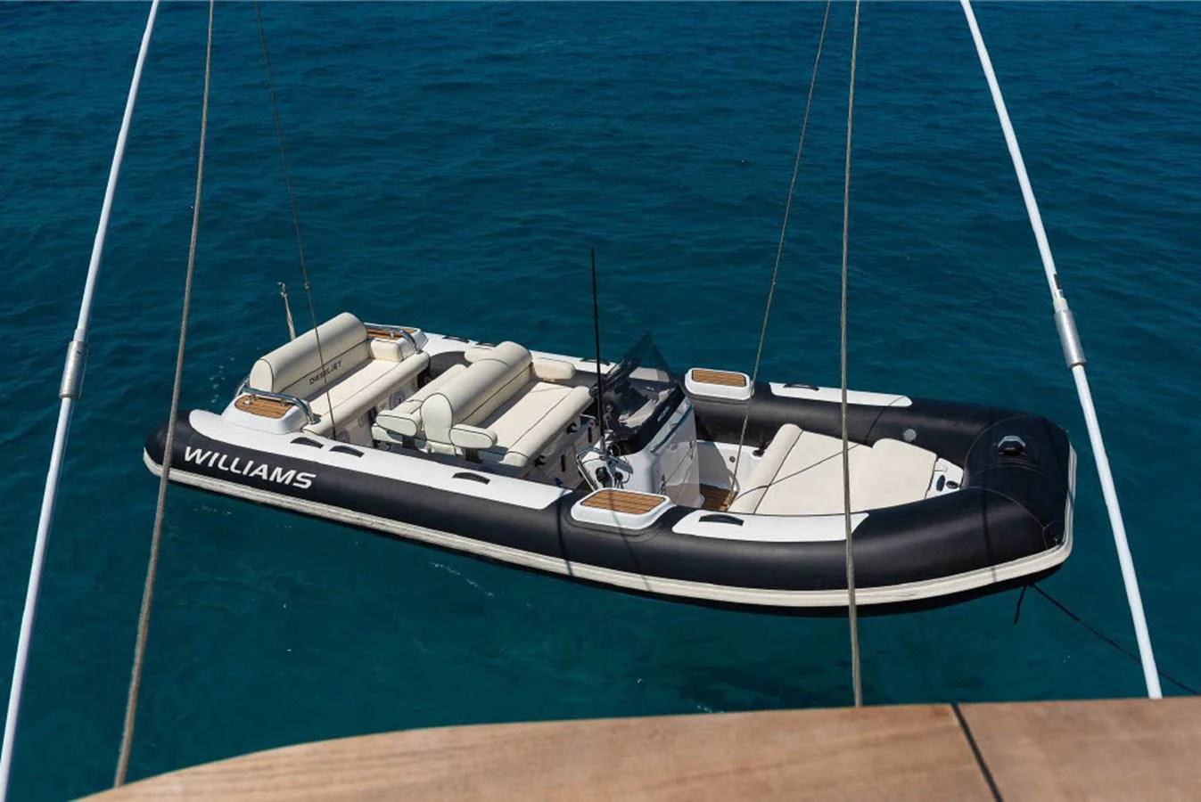 A sleek and spacious tender floats on clear blue waters, ready for adventure. aboard ON Yacht for Sale