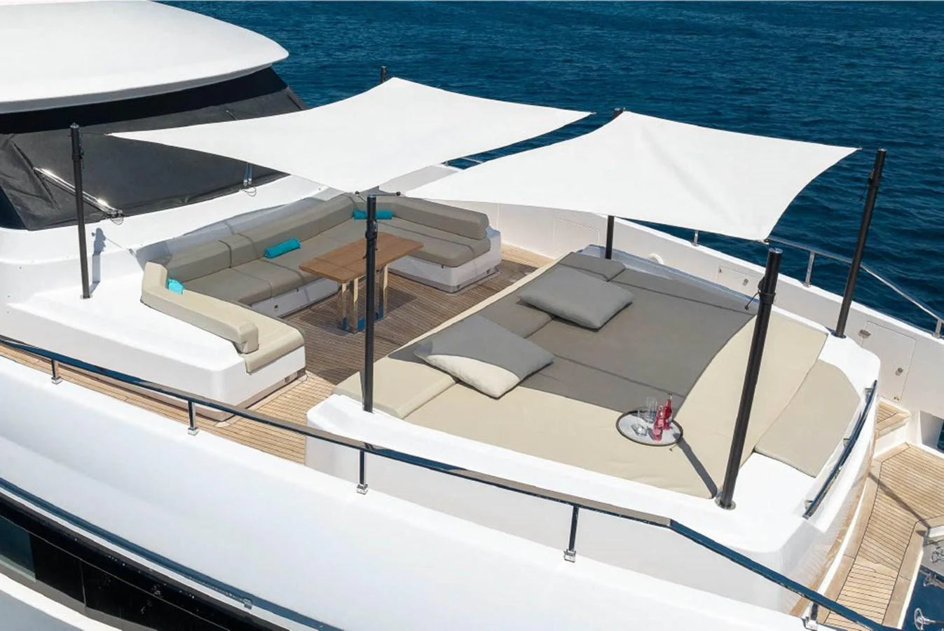 The sundeck features luxurious lounging areas with sunshades and a stunning view of the ocean. aboard ON Yacht for Sale