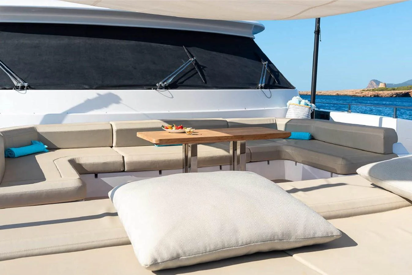 The flybridge offers a spacious seating area with a central table, perfect for relaxation and socializing while enjoying the sea view. aboard ON Yacht for Sale
