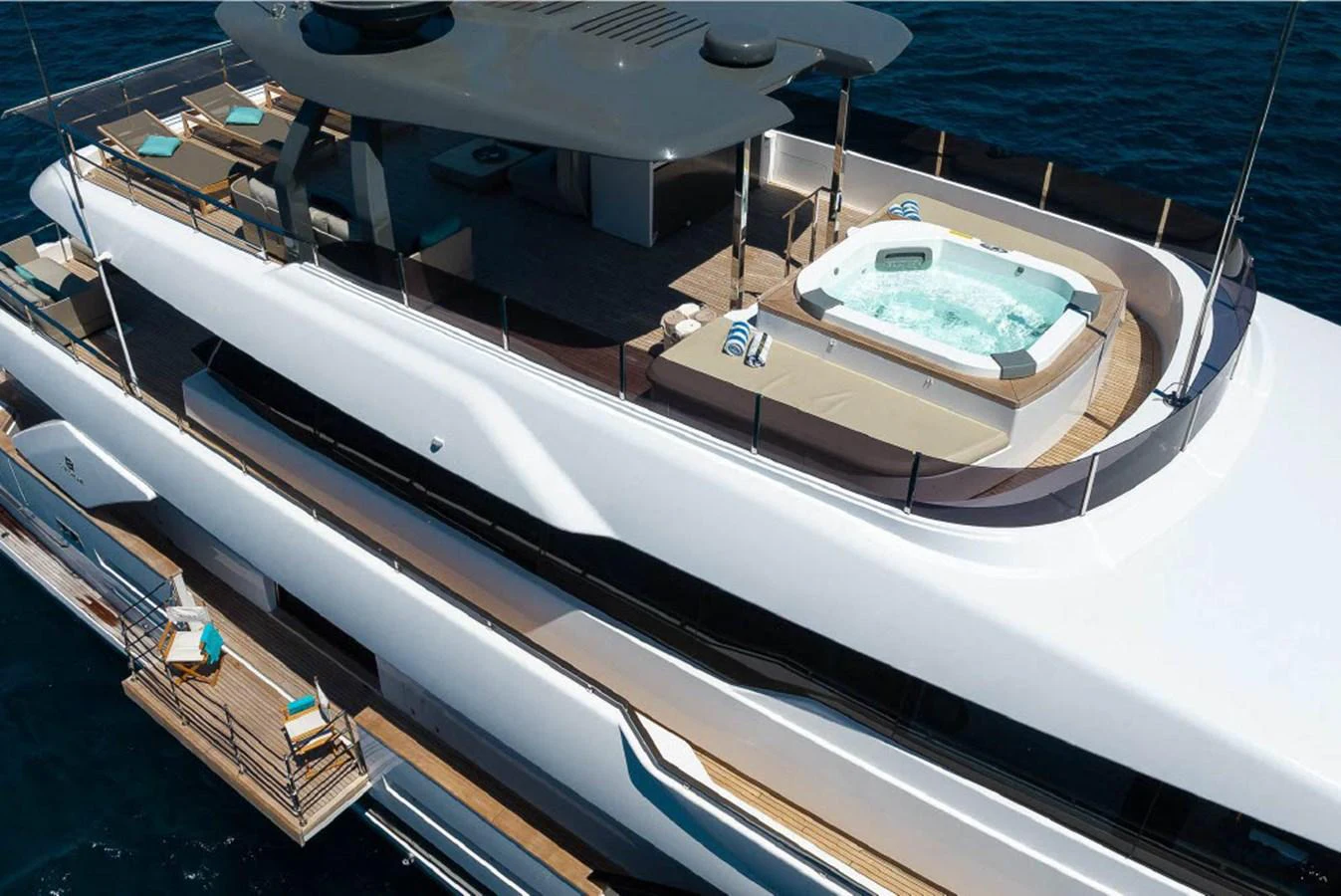 The yacht features a luxurious sundeck with a spacious hot tub and ample lounging areas. aboard ON Yacht for Sale