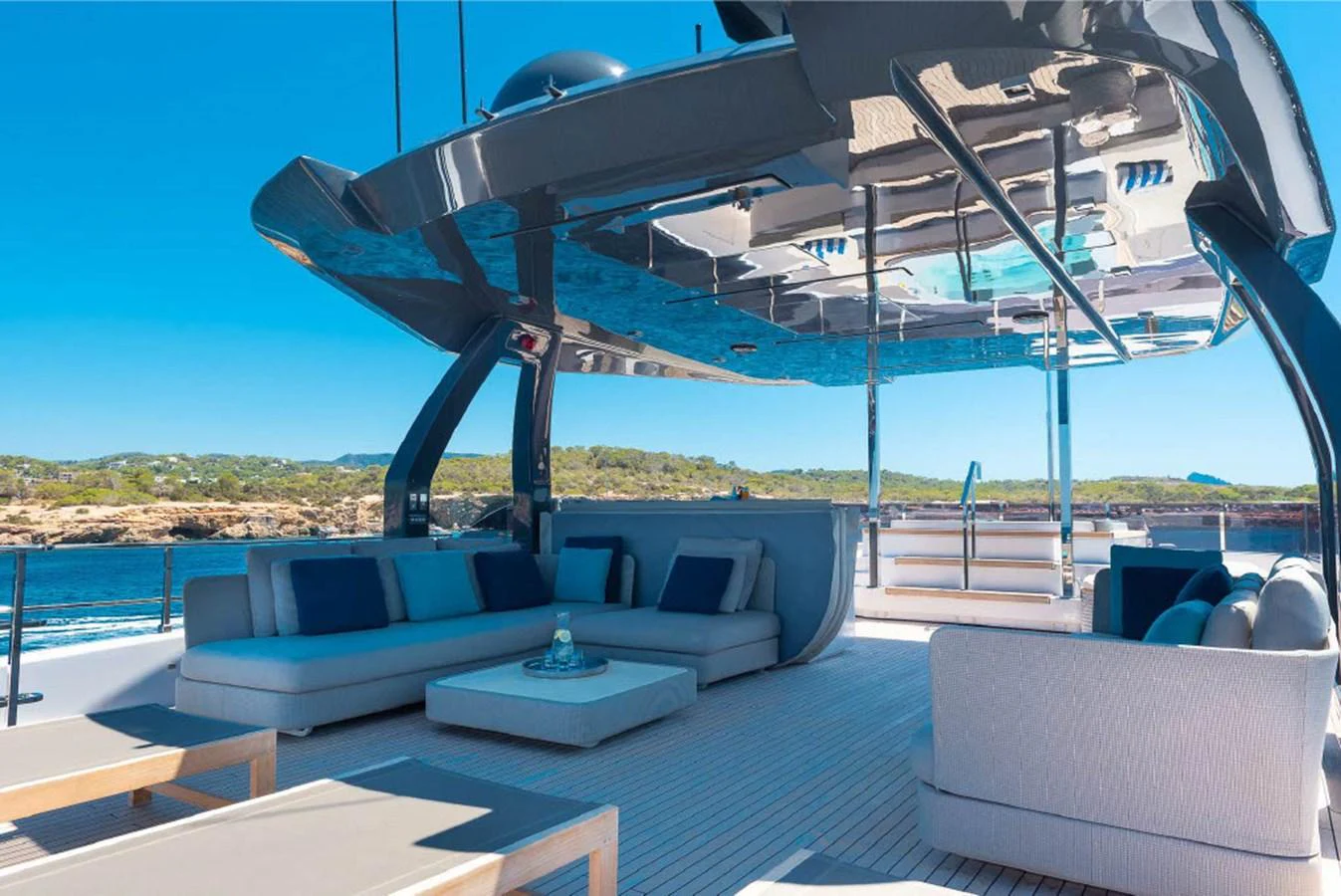 The flybridge offers a luxurious outdoor lounging area with comfortable seating and stunning views. aboard ON Yacht for Sale