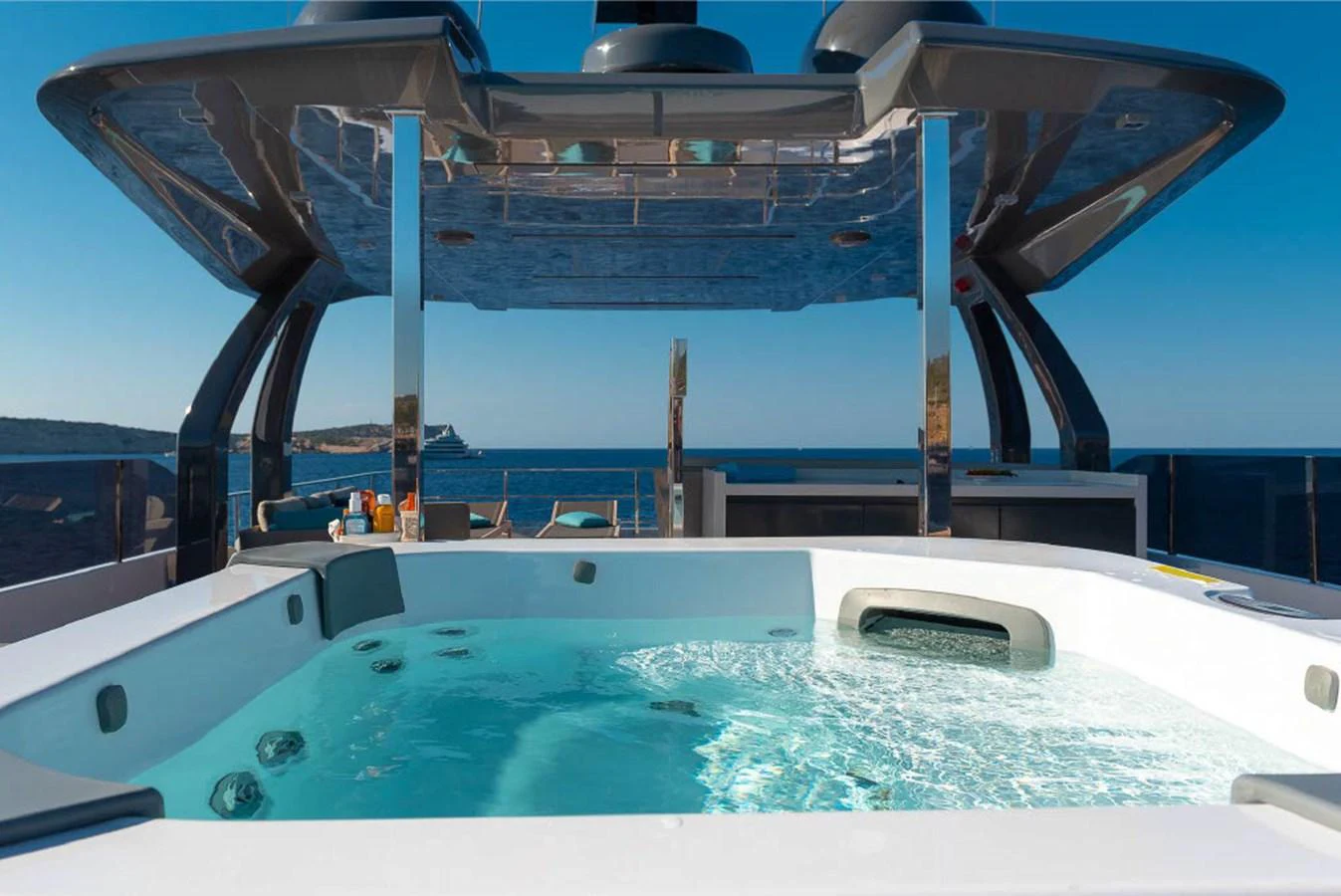 The yacht features a luxurious jacuzzi on the sundeck with stunning ocean views. aboard ON Yacht for Sale