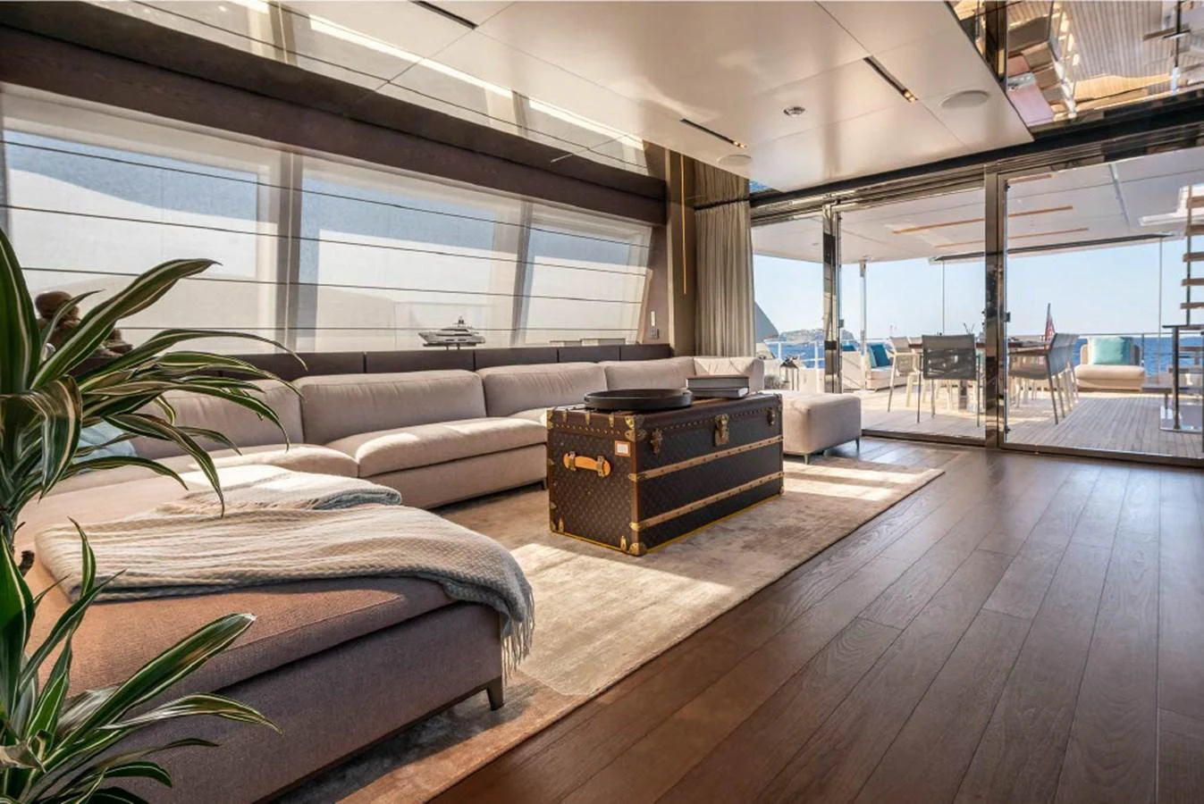 The salon offers a spacious and luxurious seating area with large windows providing ample natural light and stunning views. aboard ON Yacht for Sale