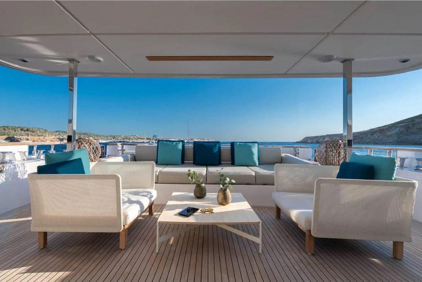The aft deck features a luxurious seating area with plush cushions and a stunning view of the sea. aboard ON Yacht for Sale