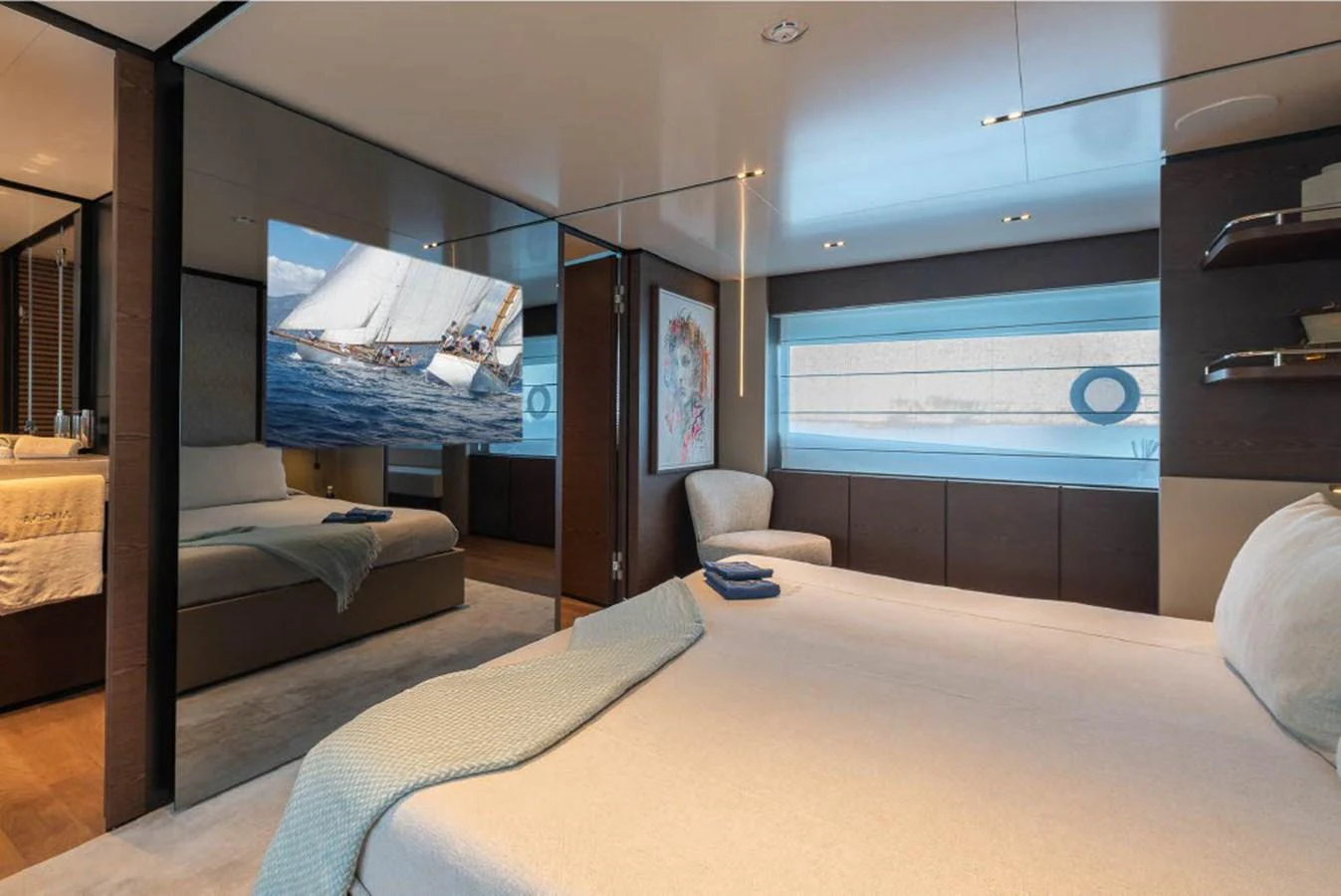 The stateroom features a luxurious bed, modern decor, and ample natural light. aboard ON Yacht for Sale