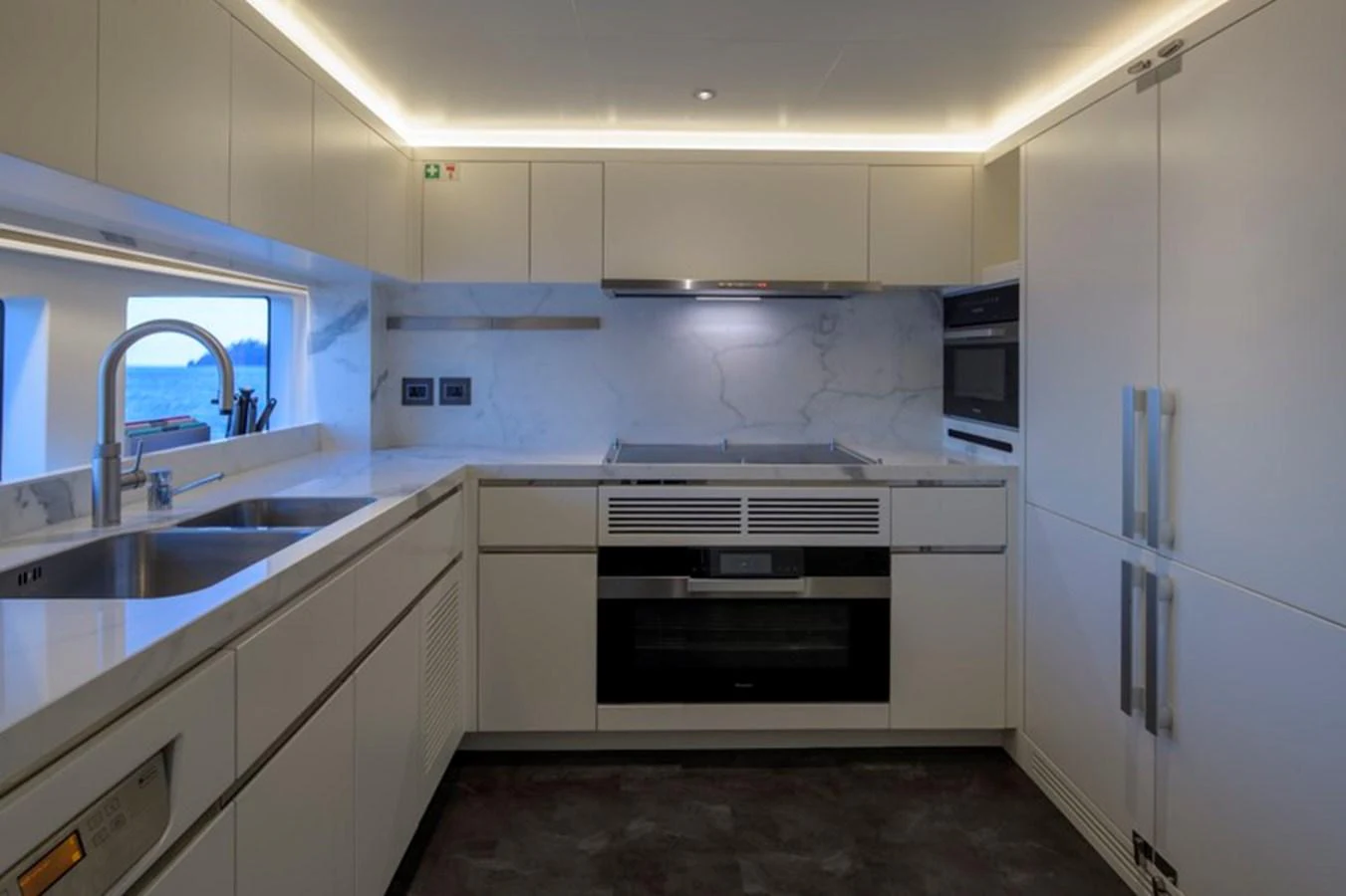 The yacht's galley features modern appliances and sleek, minimalist design. aboard BIG M Yacht for Sale