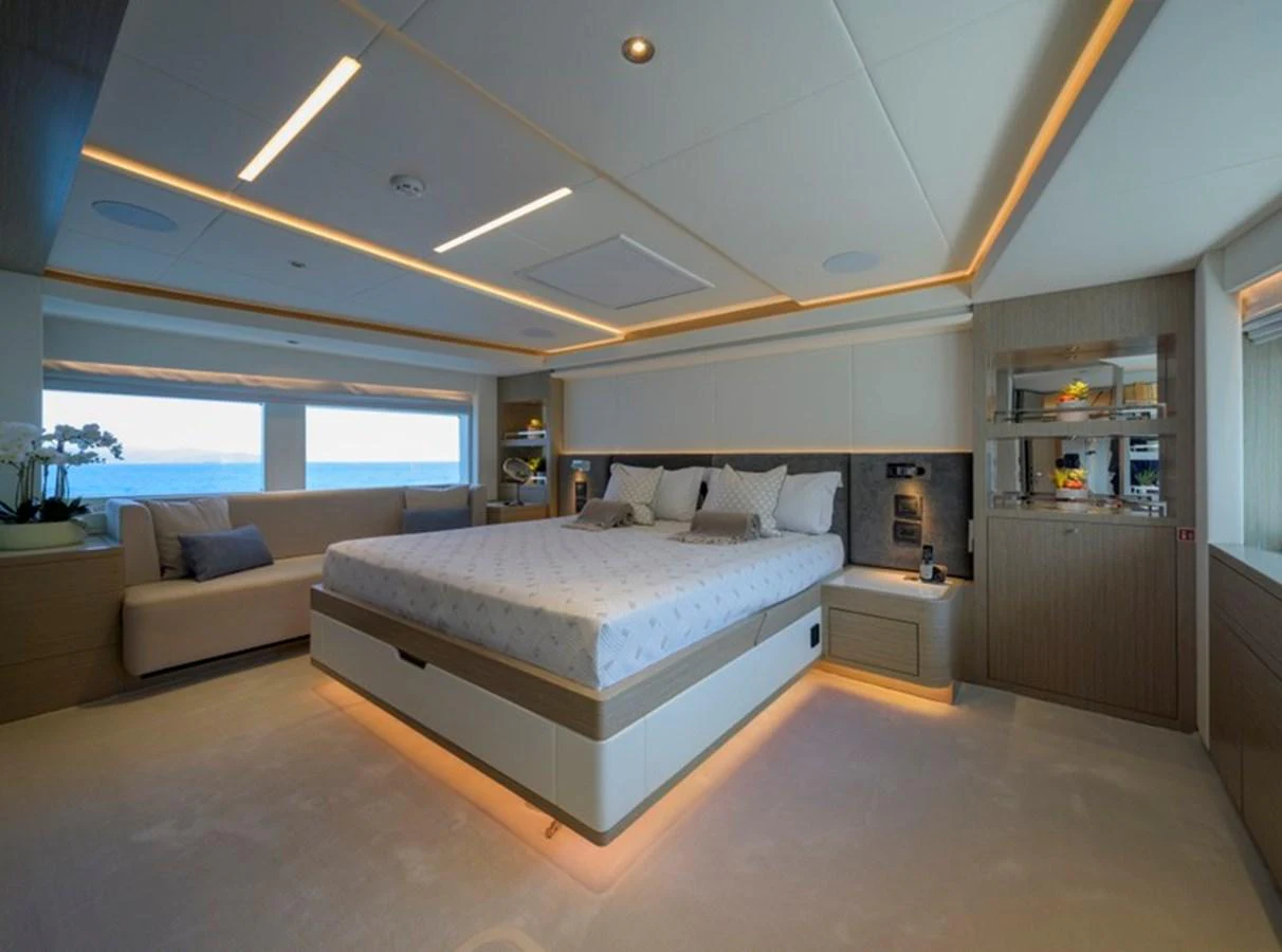 The master stateroom offers a spacious and luxurious retreat with modern furnishings and ample natural light. aboard BIG M Yacht for Sale
