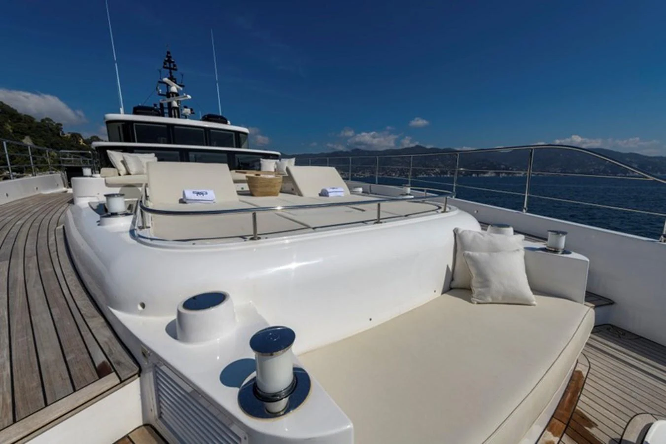 The yacht's sundeck offers luxurious lounging with expansive views of the surrounding waters. aboard BIG M Yacht for Sale