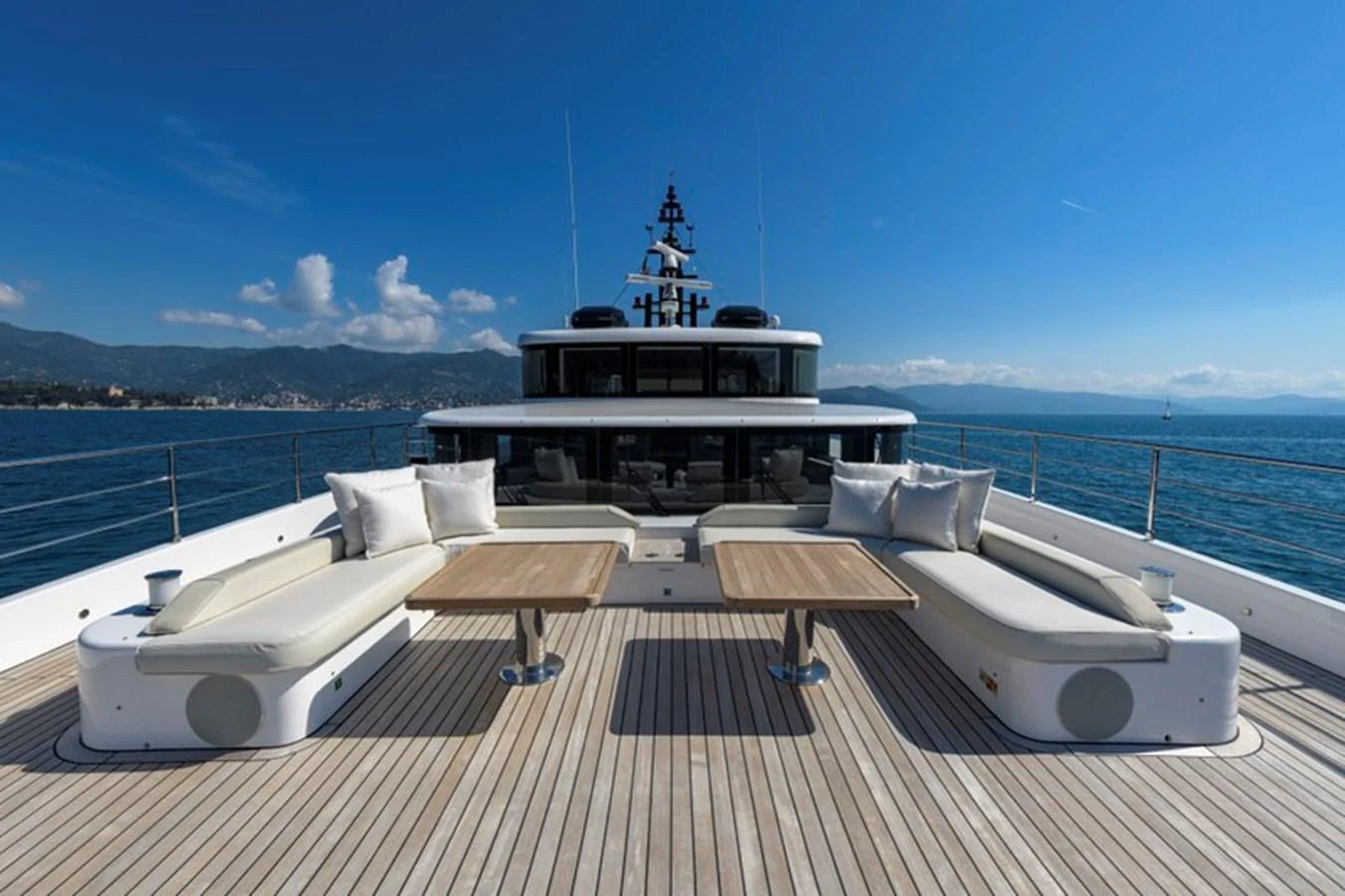 The sundeck offers a spacious and inviting area with comfortable seating and stunning ocean views. aboard BIG M Yacht for Sale