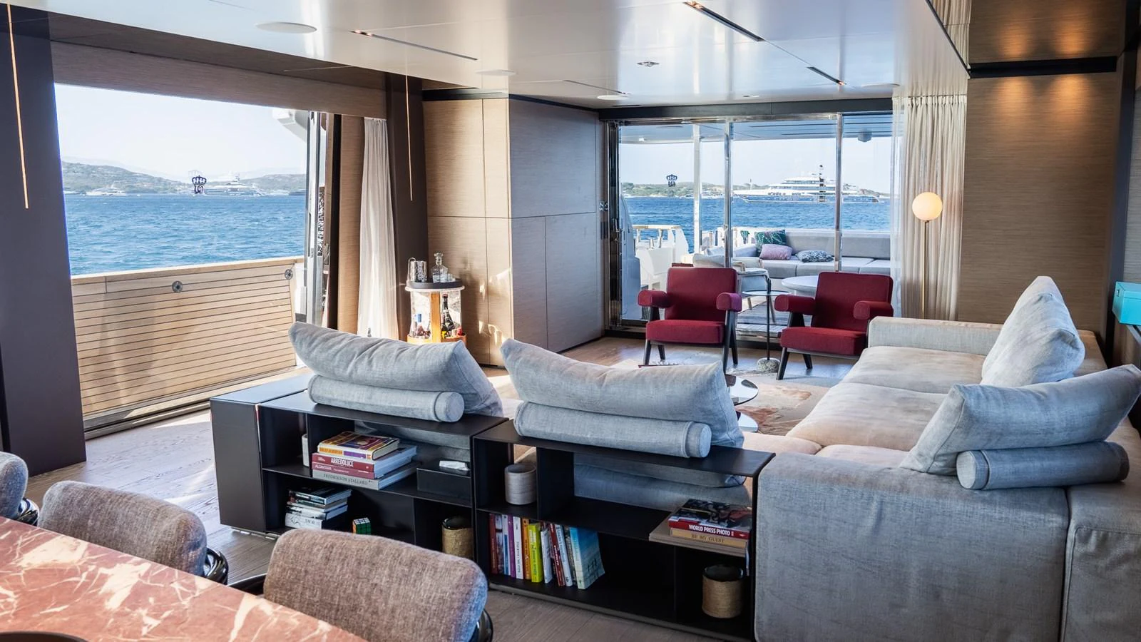 The salon offers a spacious and comfortable seating area with panoramic views of the sea. aboard QUEEN J III Yacht for Sale