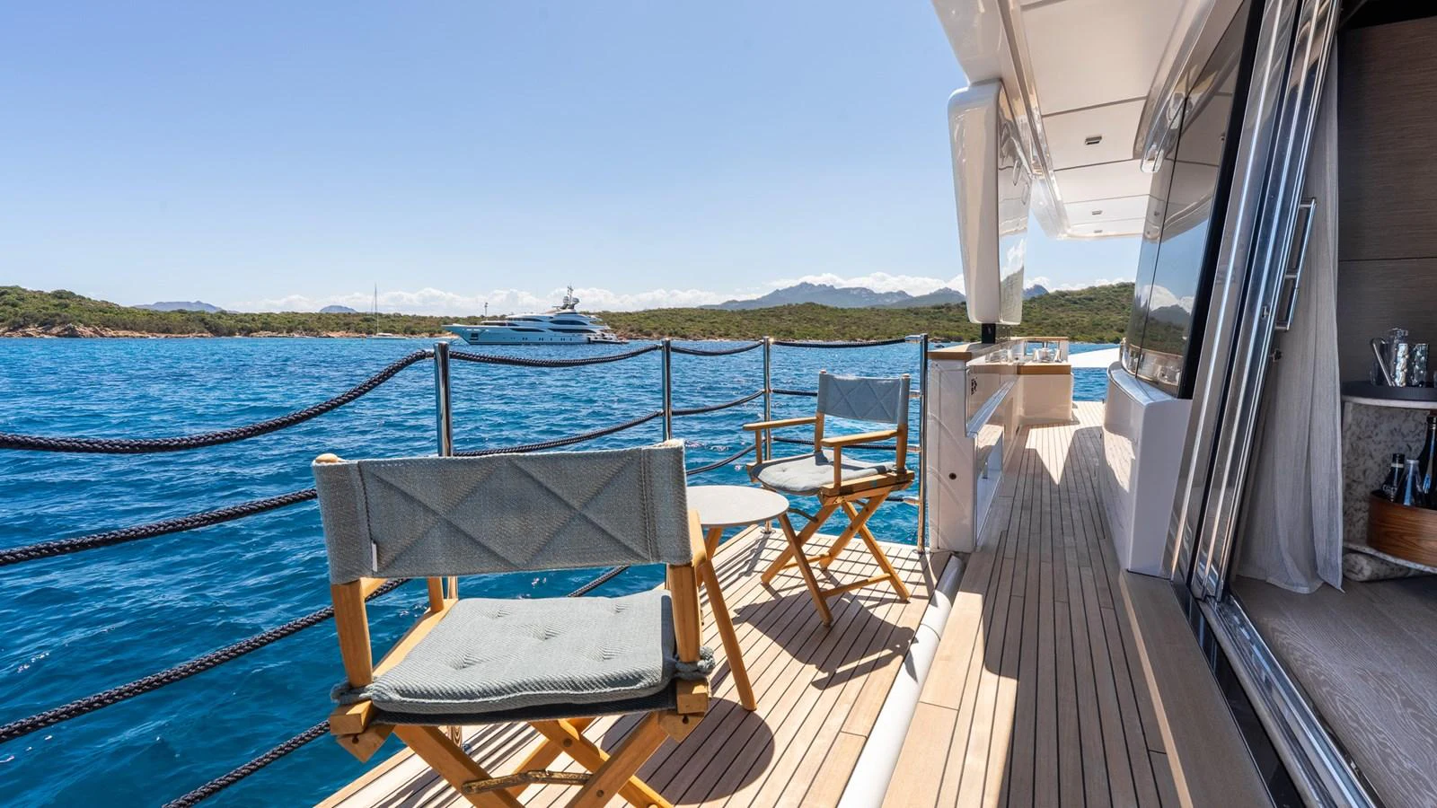 The aft deck offers a serene space with comfortable seating and stunning ocean views. aboard QUEEN J III Yacht for Sale