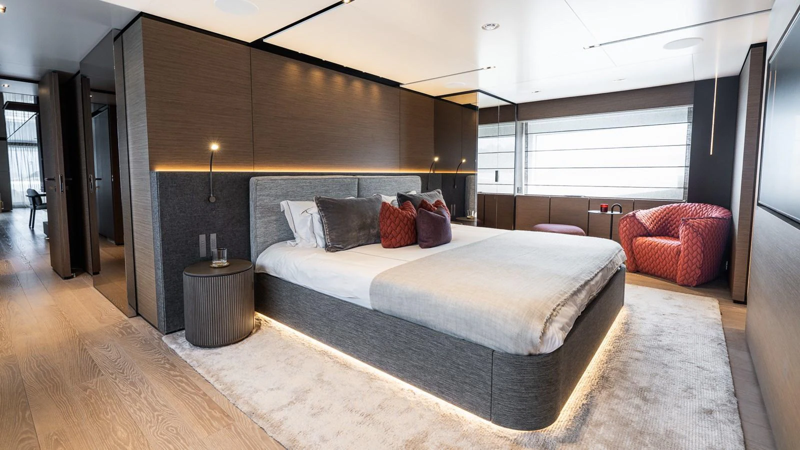 The master stateroom features a luxurious bed, modern furnishings, and ample natural light. aboard QUEEN J III Yacht for Sale
