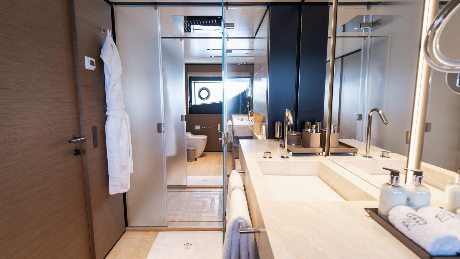 The yacht's bathroom features modern fixtures and a sleek design, offering a luxurious and comfortable space. aboard QUEEN J III Yacht for Sale