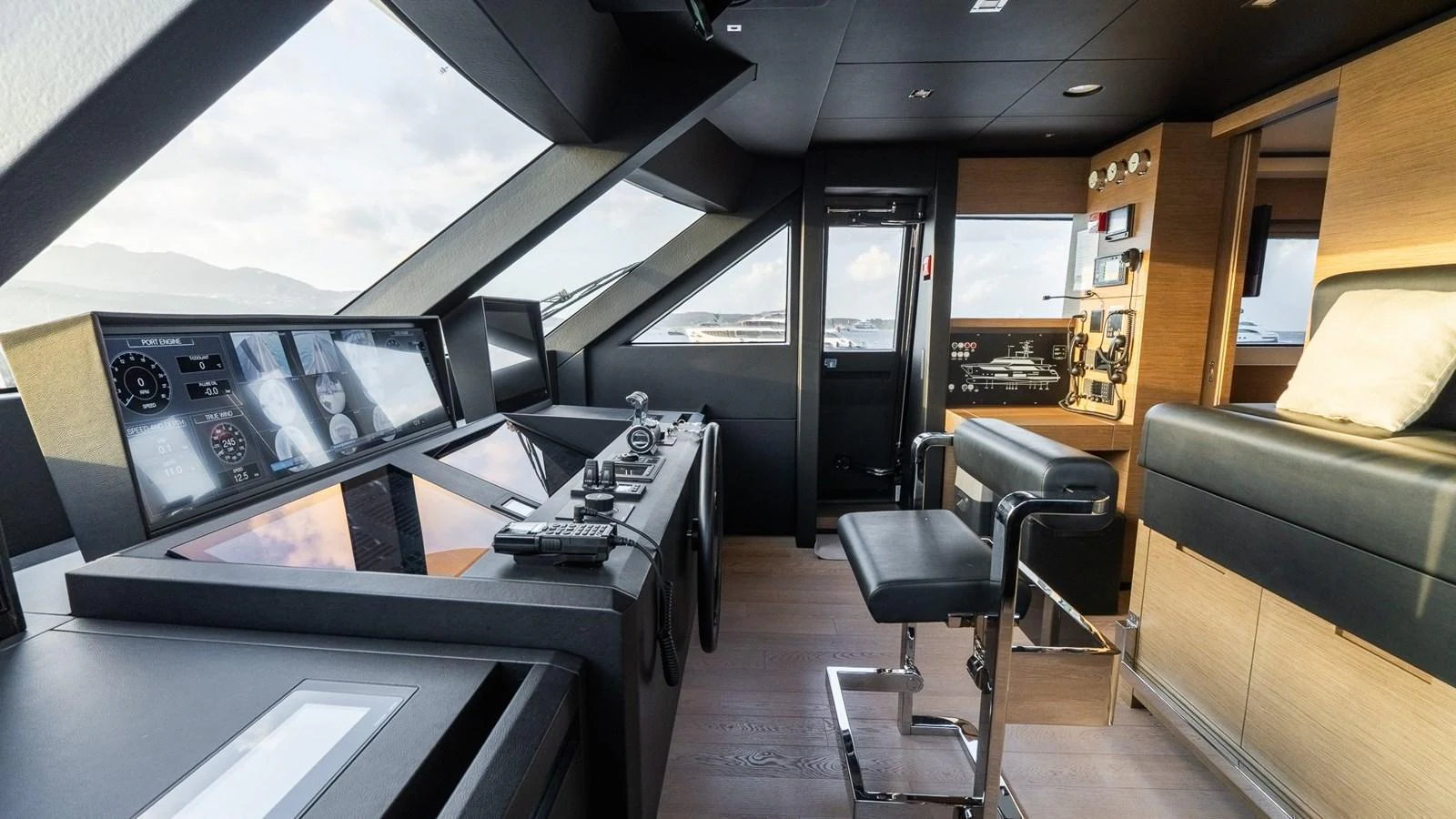 The helm station features state-of-the-art navigation equipment and luxurious seating. aboard QUEEN J III Yacht for Sale