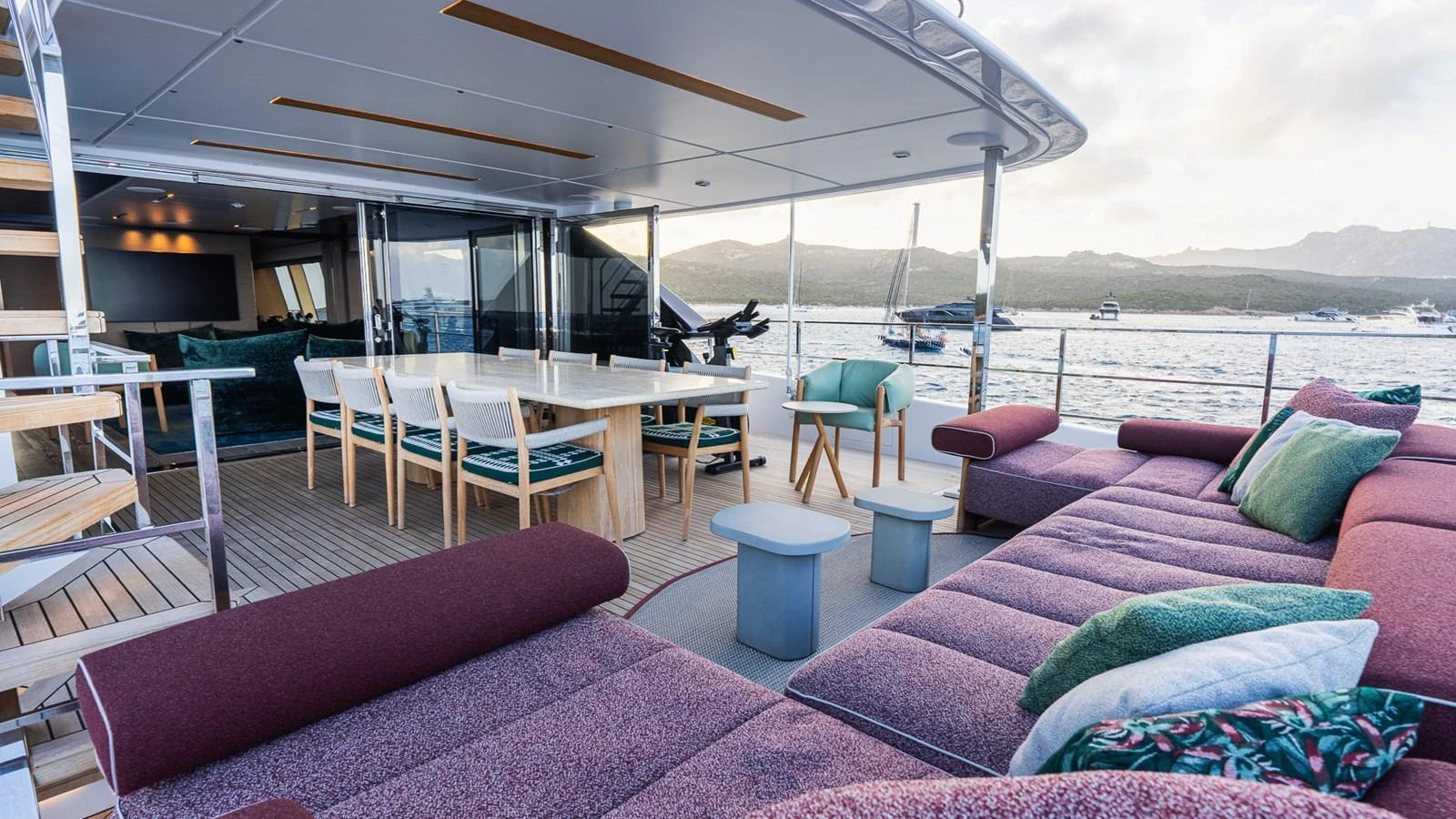 The aft deck offers a spacious and comfortable outdoor seating area with stunning views of the surrounding waters. aboard QUEEN J III Yacht for Sale