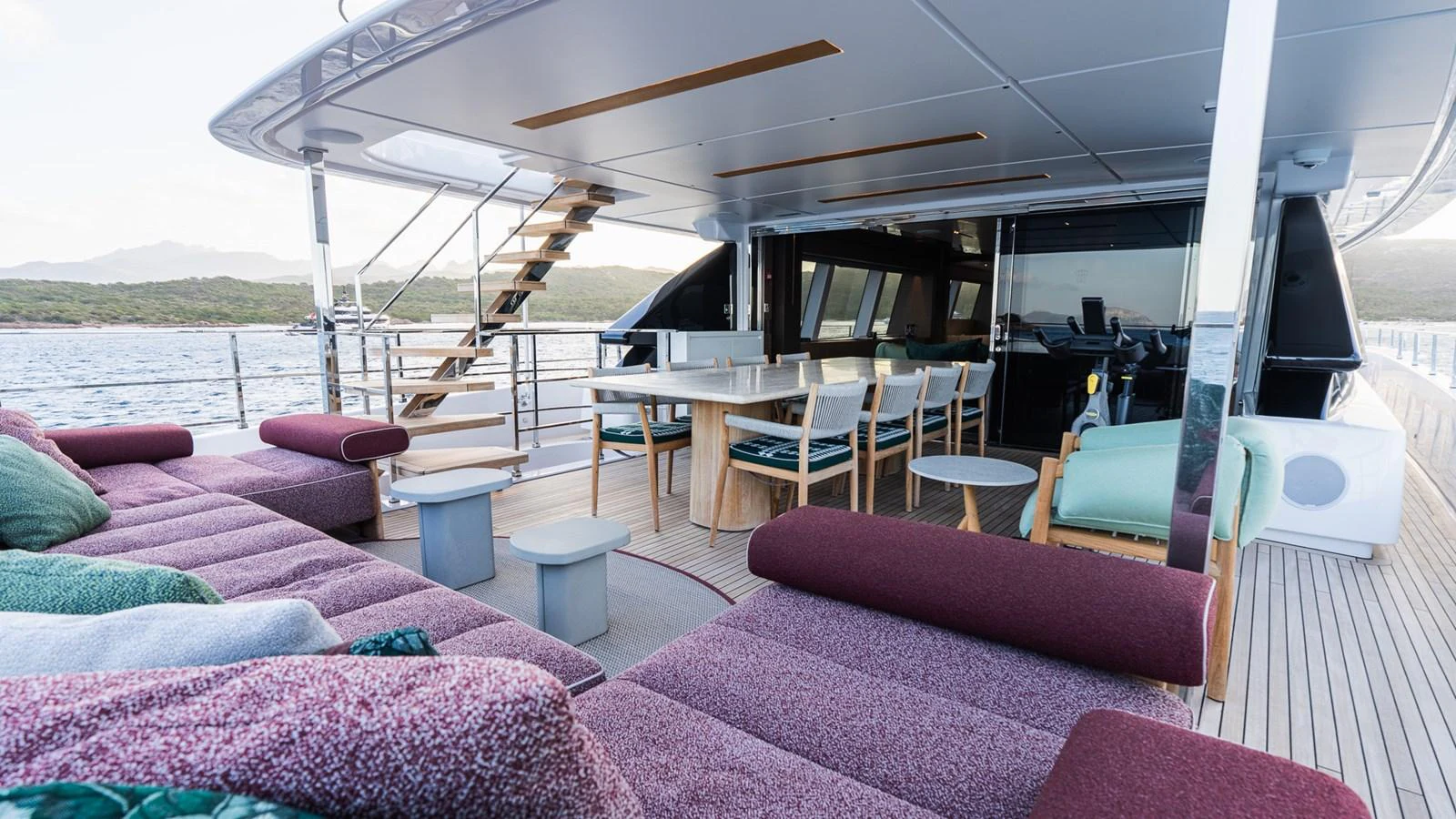 The aft deck offers a spacious and comfortable outdoor lounging and dining area with stunning views of the surrounding waters. aboard QUEEN J III Yacht for Sale