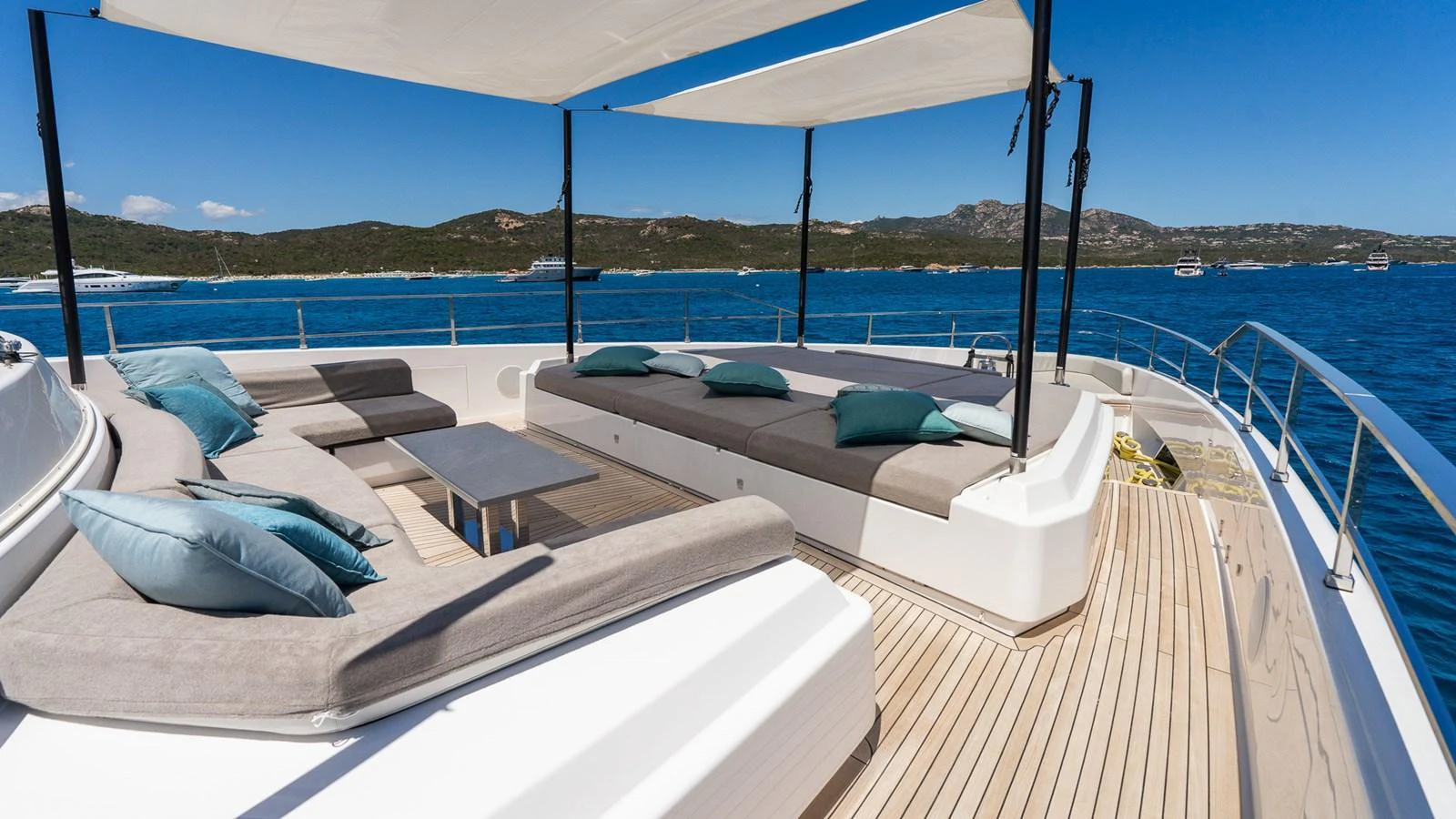 The sundeck offers a spacious lounging area with comfortable seating and stunning ocean views. aboard QUEEN J III Yacht for Sale