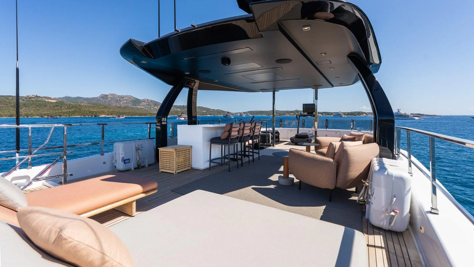 The flybridge offers a spacious and luxurious outdoor lounging area with stunning sea views. aboard QUEEN J III Yacht for Sale