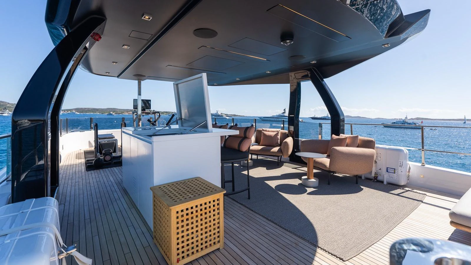 The flybridge offers a spacious and luxurious outdoor area with comfortable seating and stunning sea views. aboard QUEEN J III Yacht for Sale