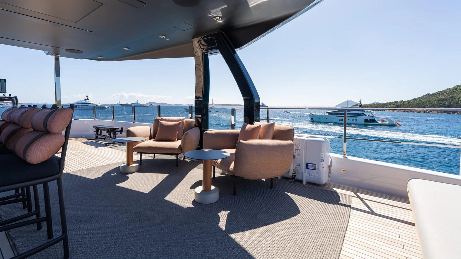 The aft deck offers a comfortable seating area with stunning ocean views. aboard QUEEN J III Yacht for Sale