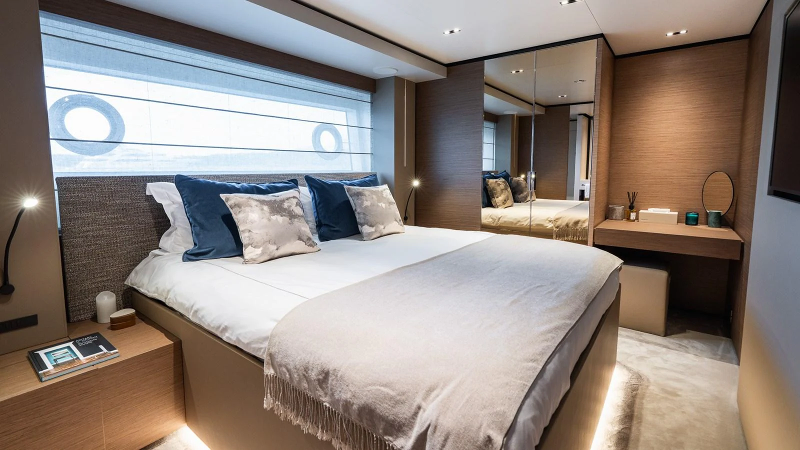 The stateroom features a plush double bed with elegant bedding and modern decor. aboard QUEEN J III Yacht for Sale