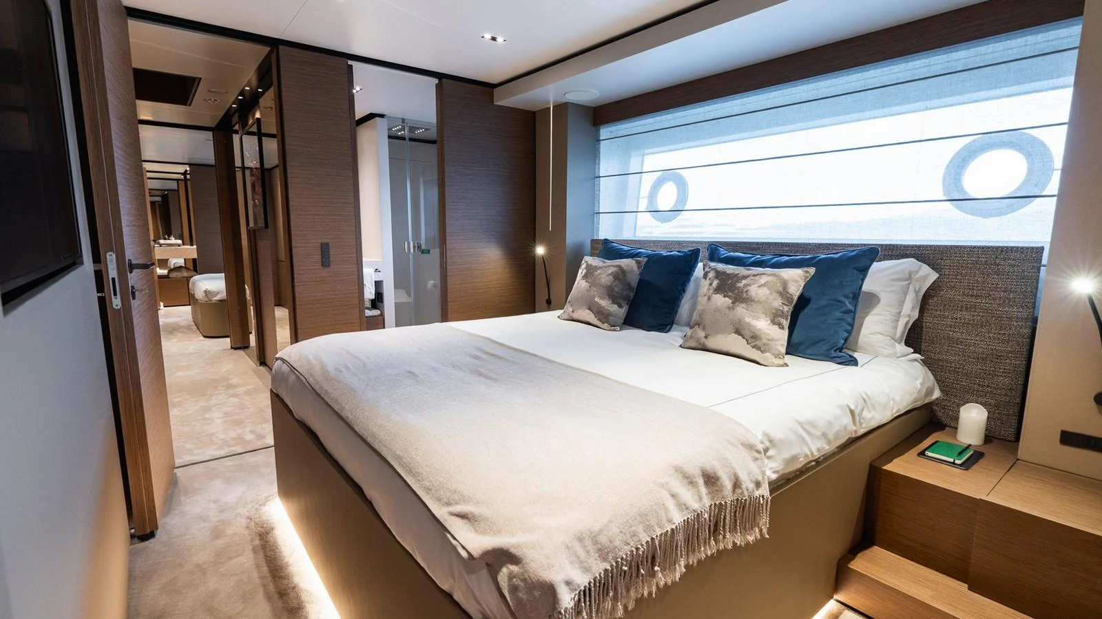 The stateroom features a plush bed with elegant bedding and modern decor. aboard QUEEN J III Yacht for Sale