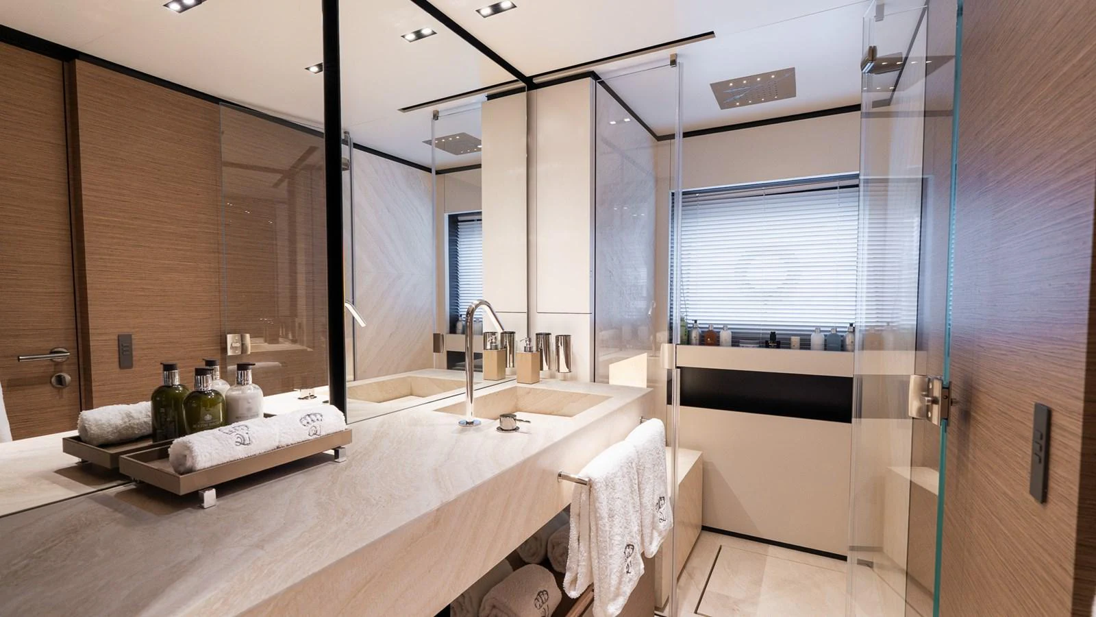 The yacht's bathroom features a modern design with luxurious amenities and elegant finishes. aboard QUEEN J III Yacht for Sale