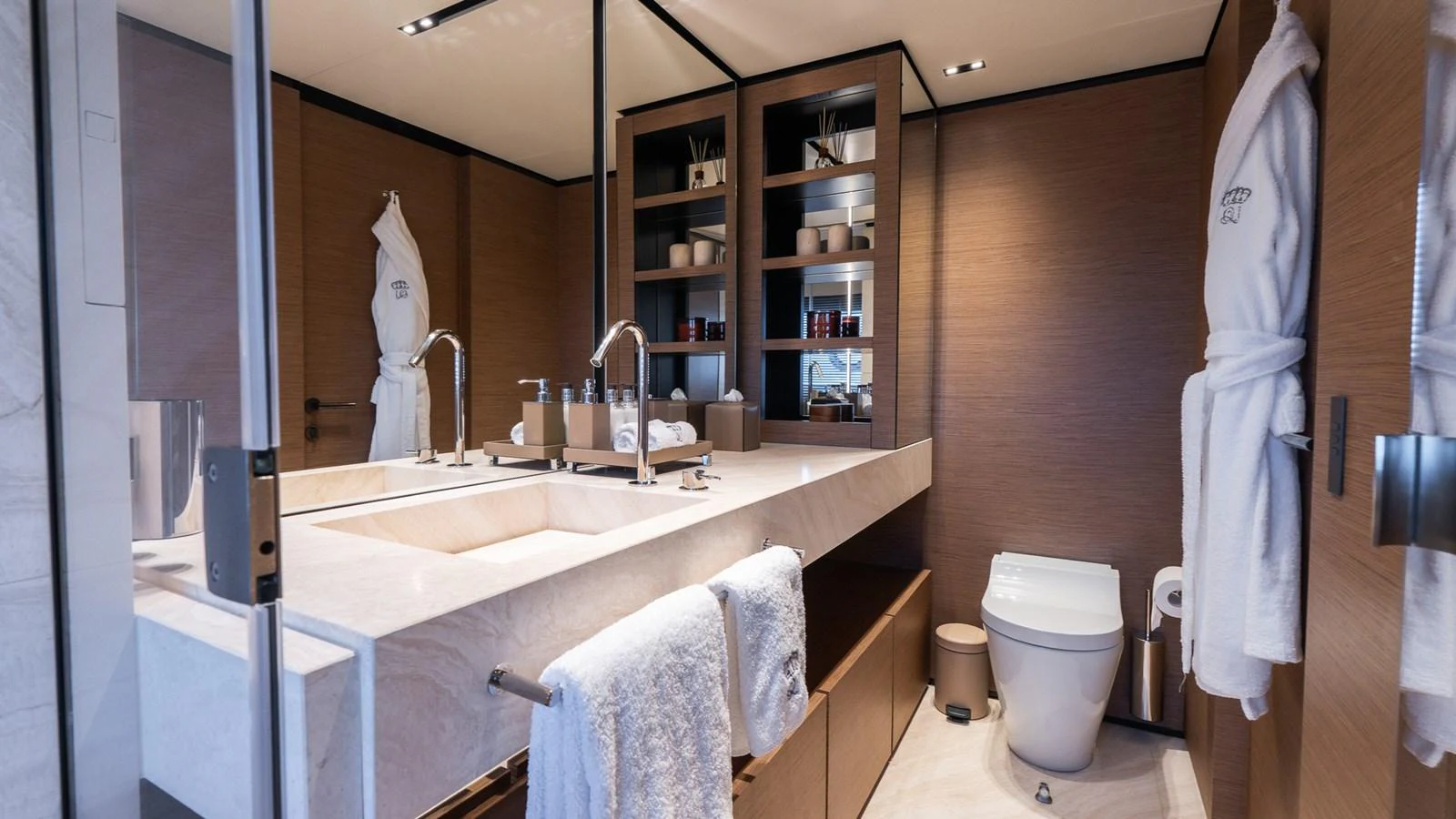 The yacht's bathroom features a luxurious double sink vanity, modern fixtures, and ample storage space. aboard QUEEN J III Yacht for Sale