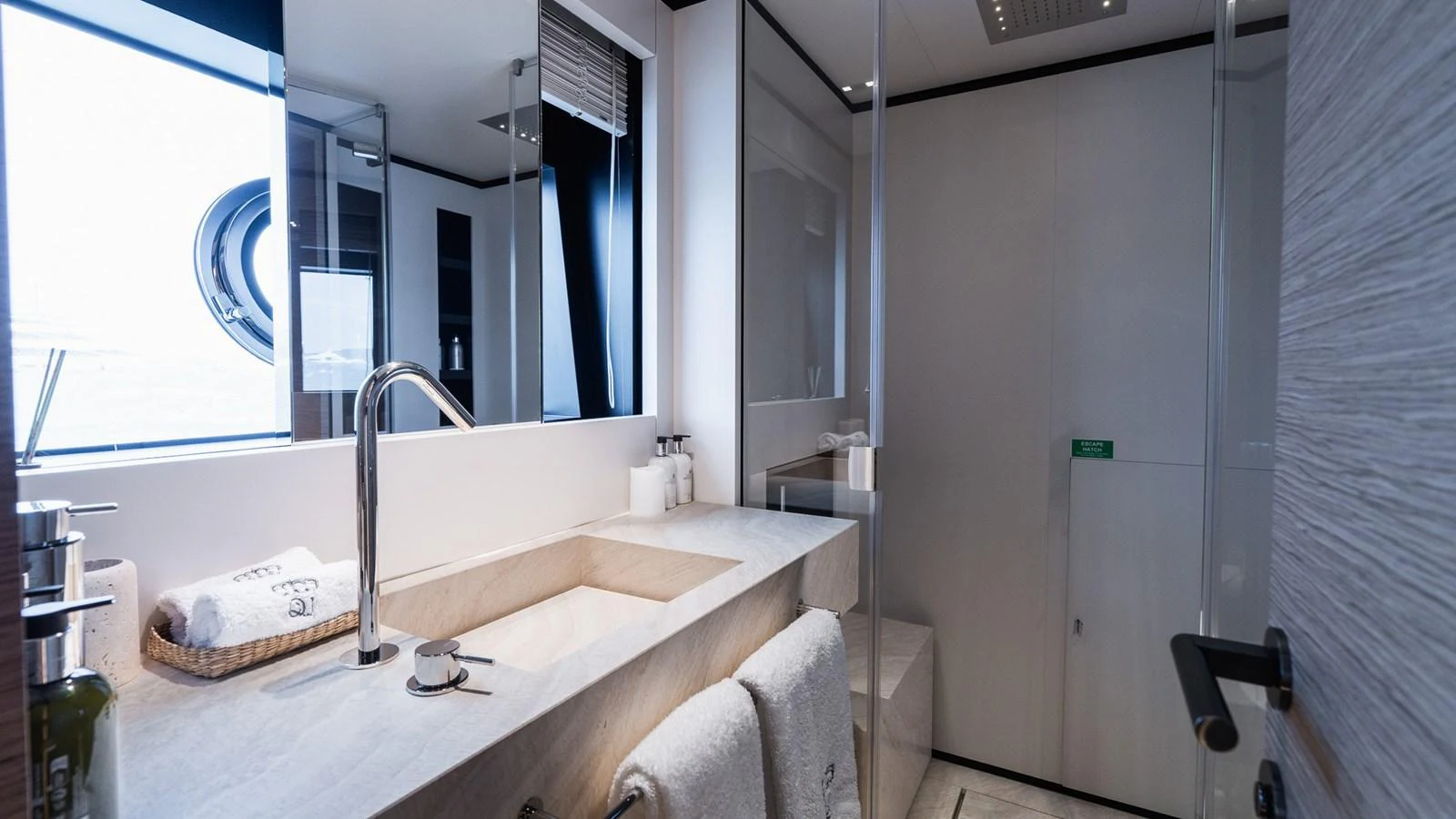 A luxurious bathroom with modern fixtures and elegant design. aboard QUEEN J III Yacht for Sale