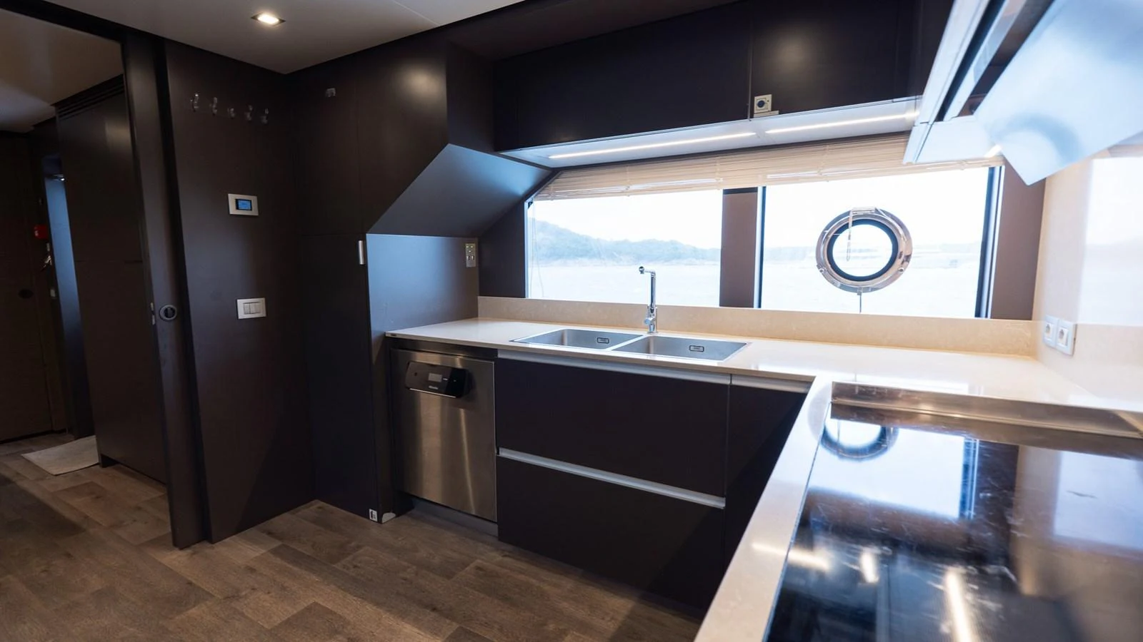 The yacht's galley features modern appliances and a sleek design, perfect for gourmet cooking. aboard QUEEN J III Yacht for Sale