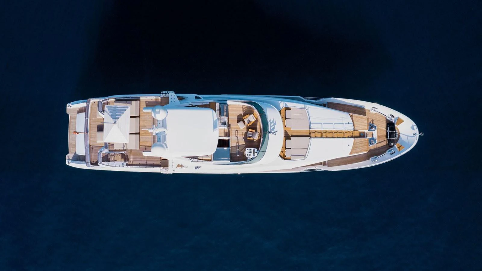 An aerial view of a luxurious yacht showcasing its spacious deck and elegant design. aboard AFINA Yacht for Sale