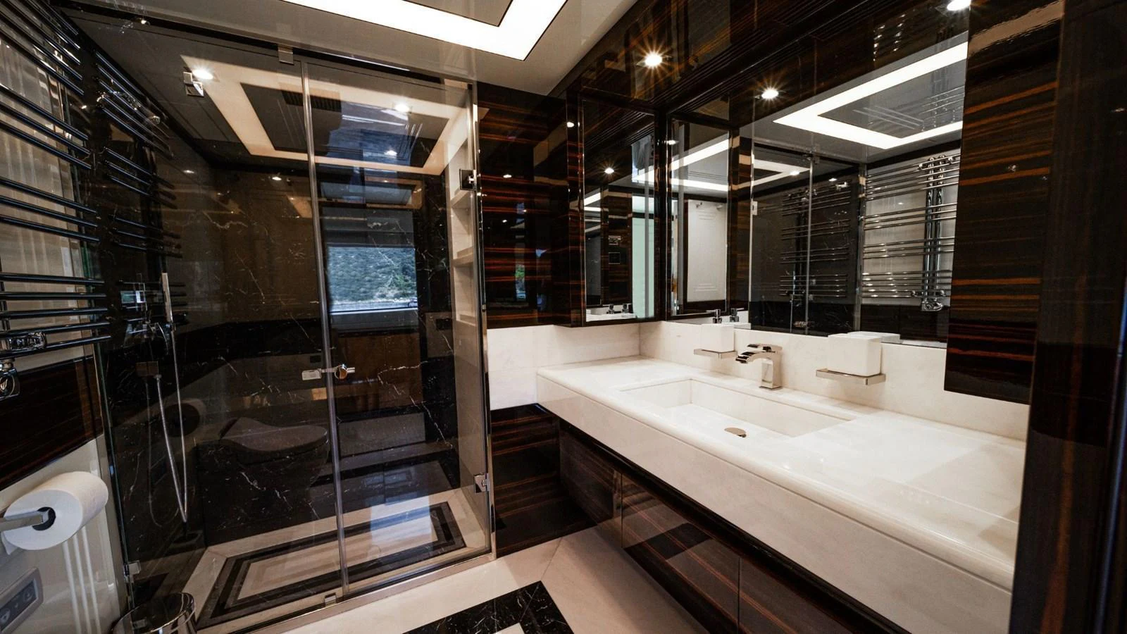 The yacht's bathroom features a luxurious design with a spacious shower and elegant fixtures. aboard AFINA Yacht for Sale