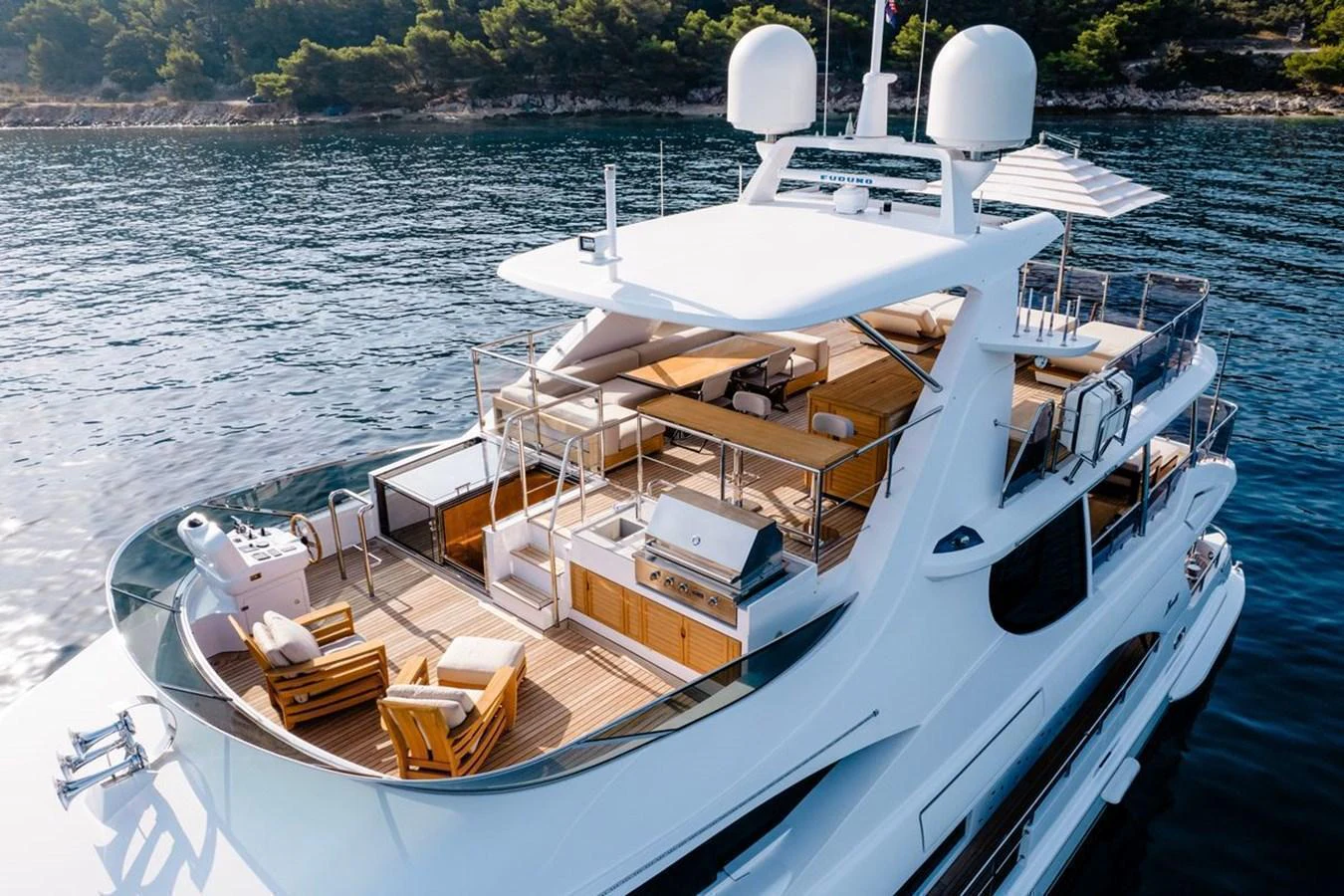 The yacht's flybridge offers a luxurious outdoor space with ample seating and stunning views. aboard AFINA Yacht for Sale