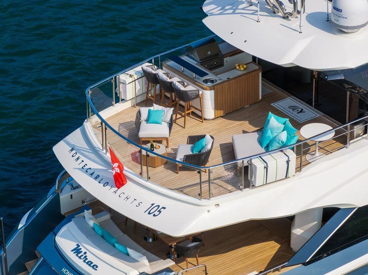 The flybridge offers a luxurious outdoor space with seating and a bar area. aboard MIRAE Yacht for Sale