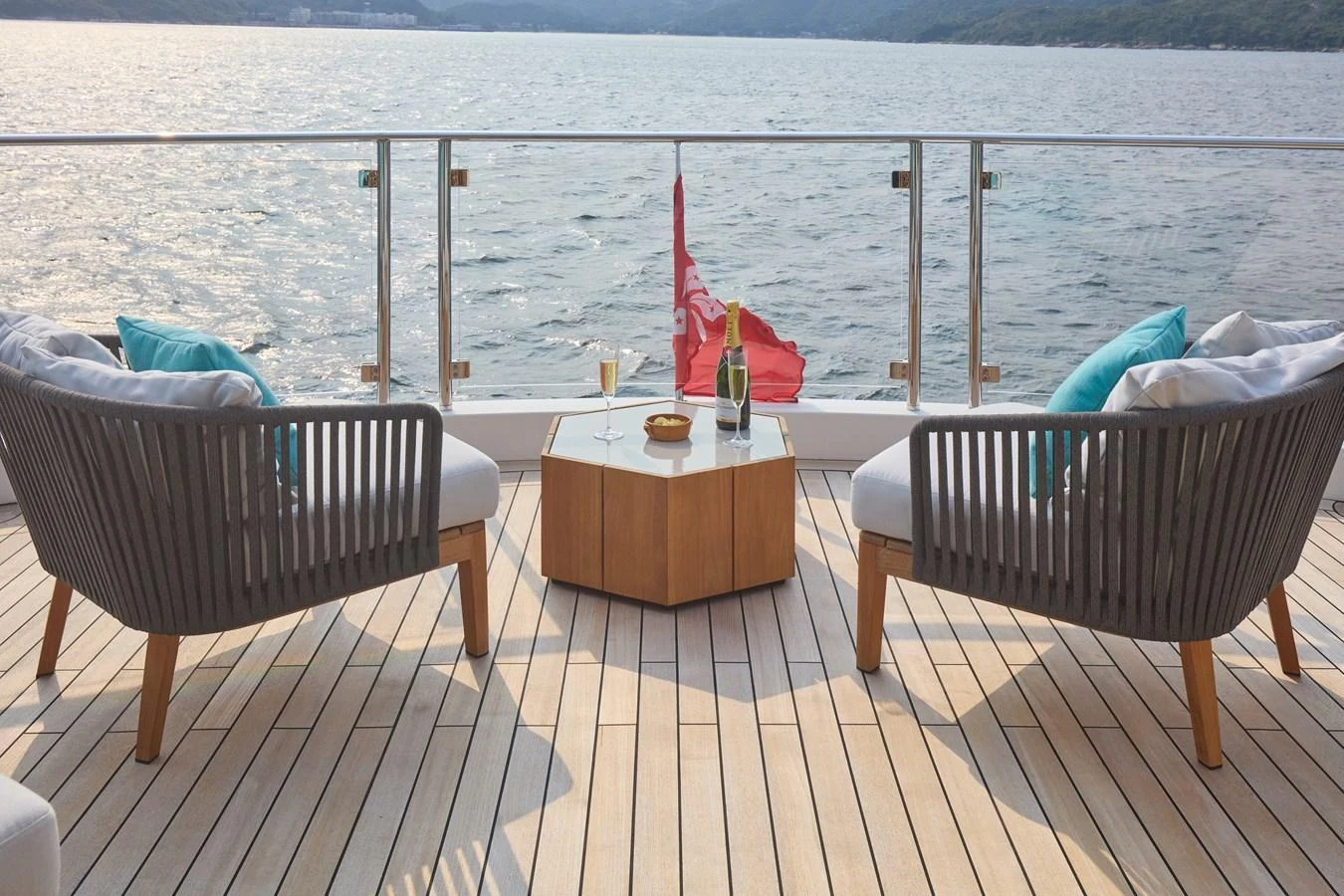 The aft deck features a serene seating area with a stunning view of the water. aboard MIRAE Yacht for Sale