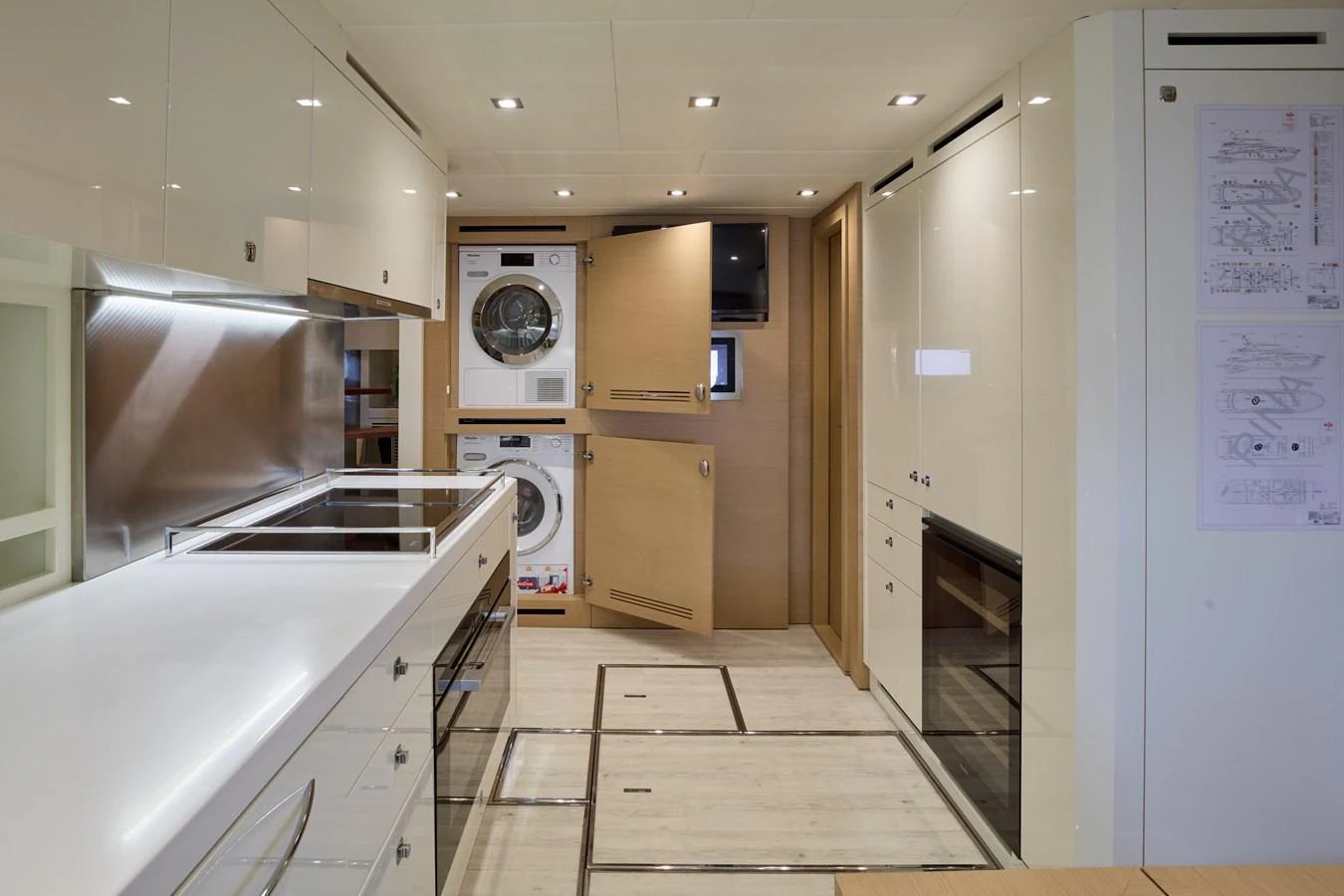 The yacht's galley is equipped with modern appliances and ample storage, providing a functional and stylish space for meal preparation. aboard MIRAE Yacht for Sale