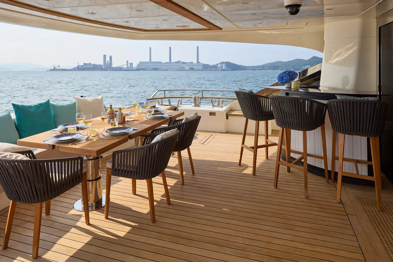 The aft deck features an elegant dining area with a stunning sea view. aboard MIRAE Yacht for Sale