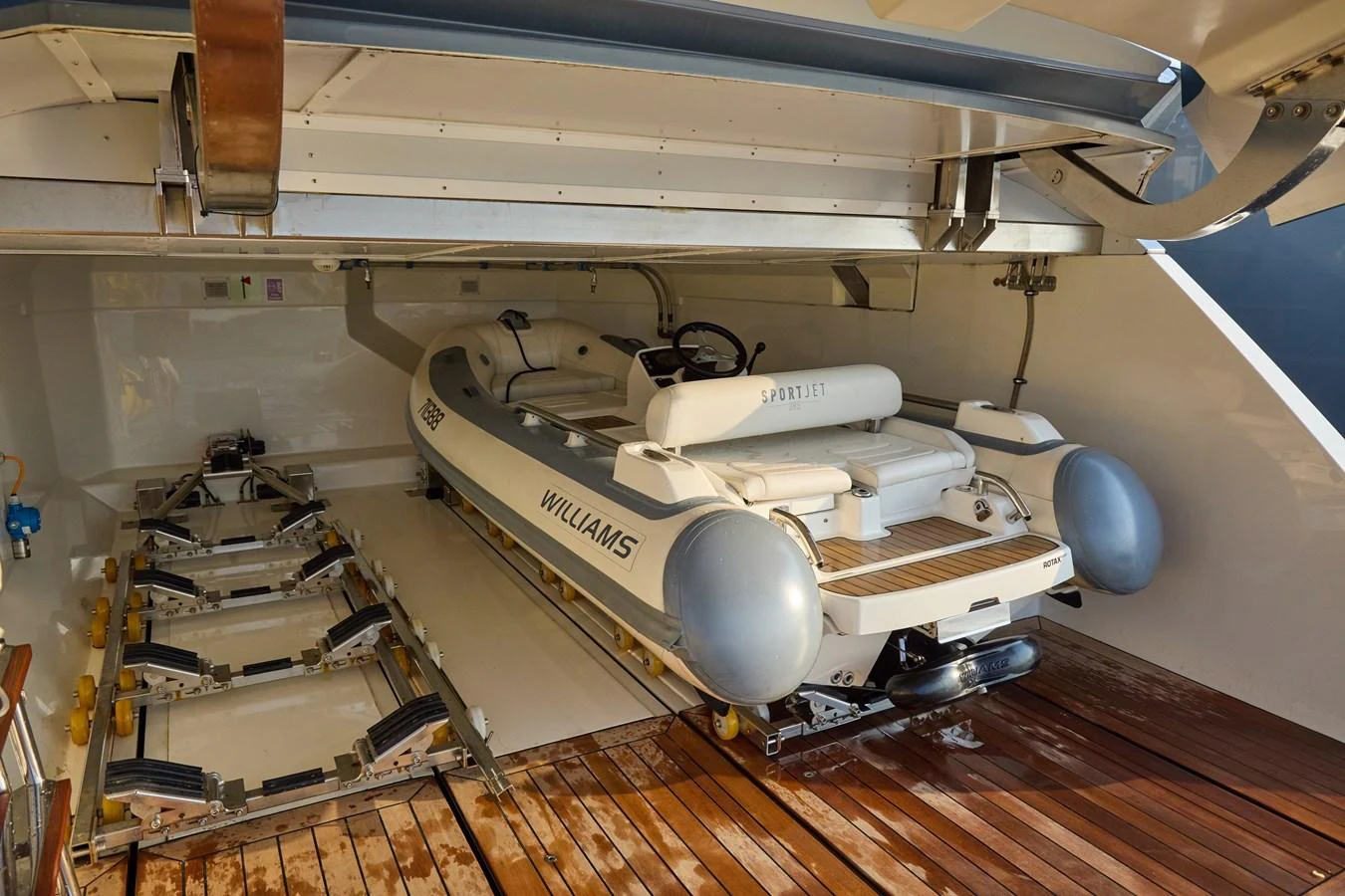 The yacht's tender is neatly stored in a dedicated garage, ready for quick deployment. aboard MIRAE Yacht for Sale