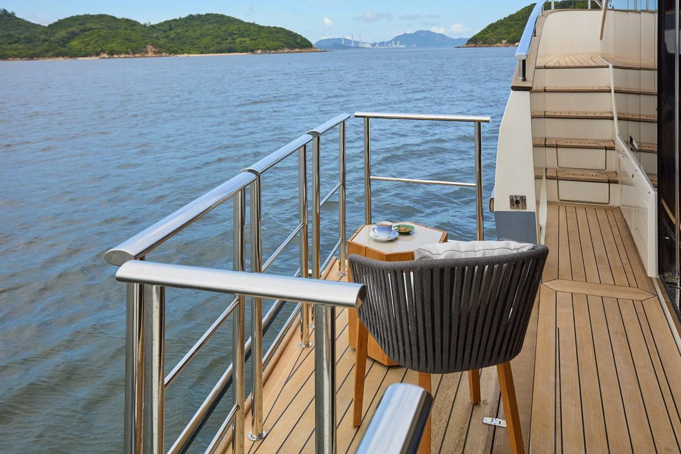 A serene deck area with a cozy seating arrangement overlooking the water. aboard MIRAE Yacht for Sale