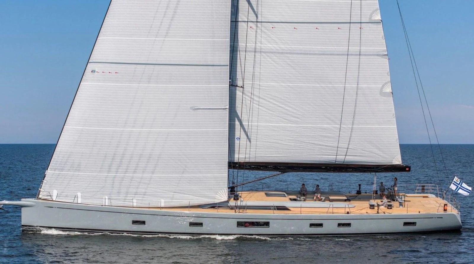 A sleek sailing yacht glides gracefully on the open water, showcasing its modern design and expansive sails. aboard FANCY Yacht for Sale