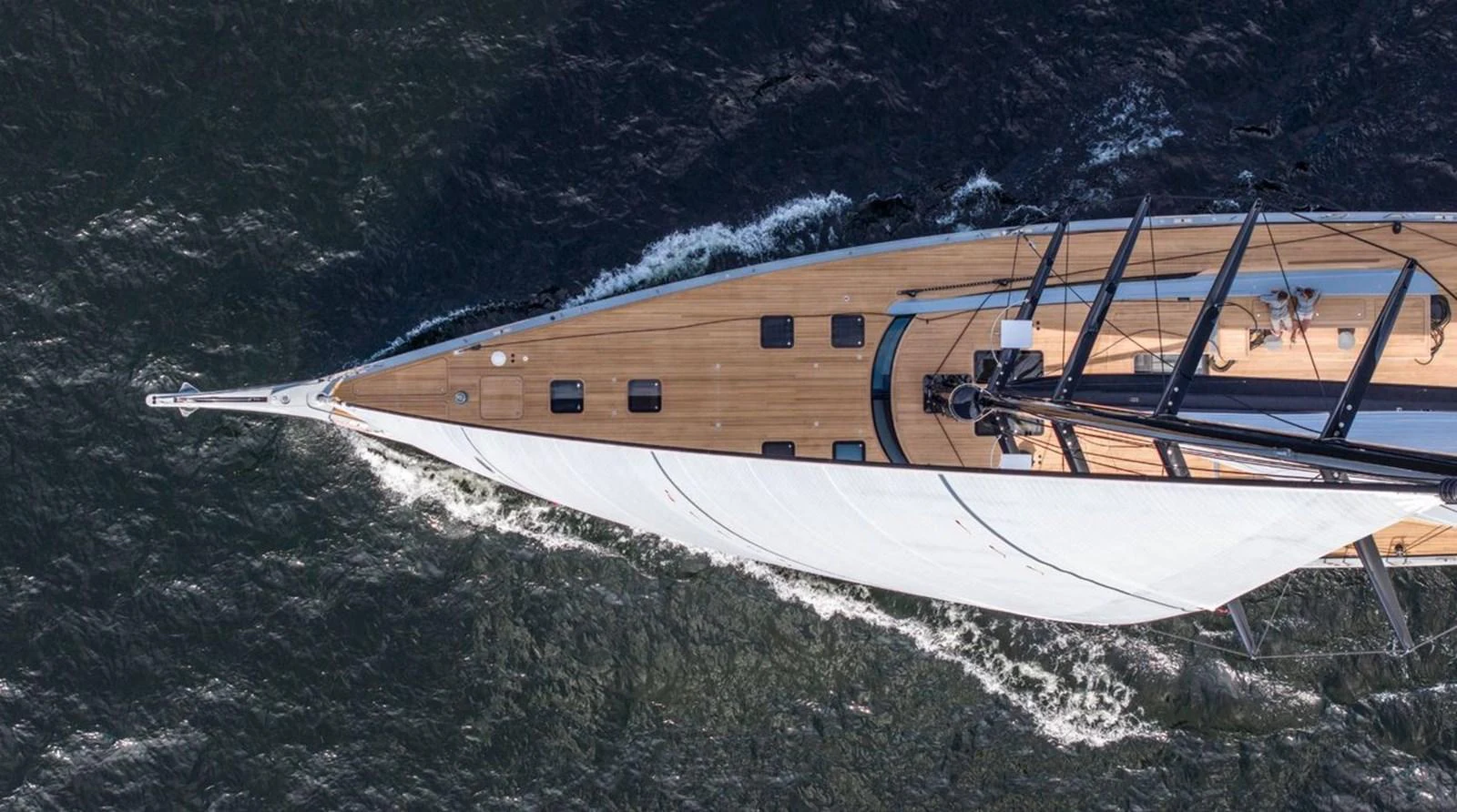 An aerial view of a sleek sailing yacht cutting through the water. aboard FANCY Yacht for Sale