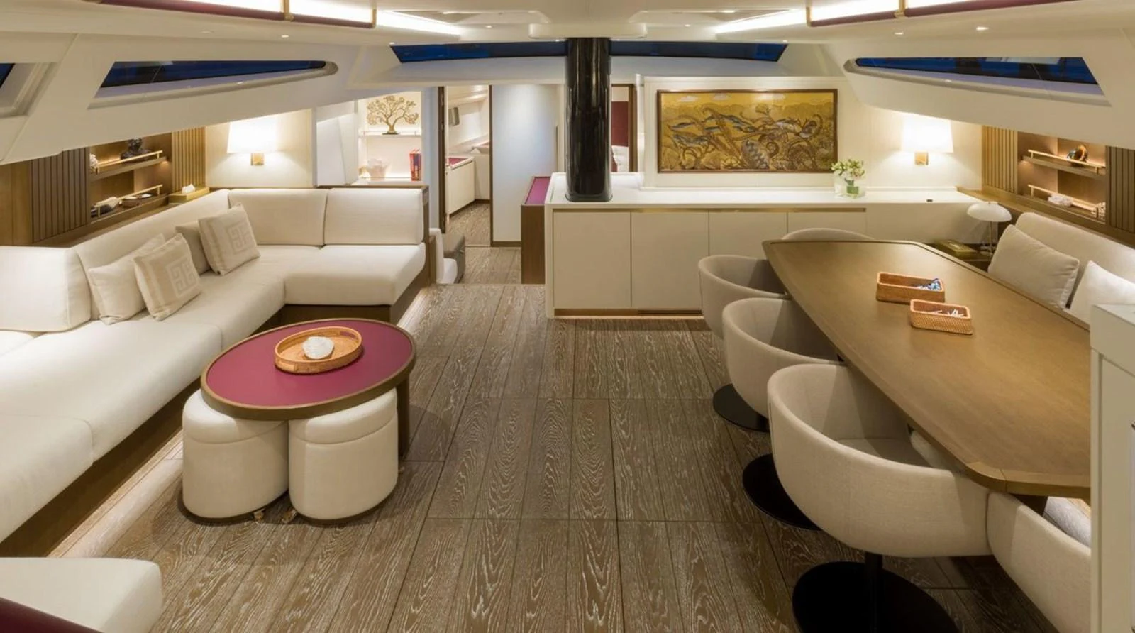 The spacious salon features elegant seating and a sophisticated dining area with modern decor. aboard FANCY Yacht for Sale
