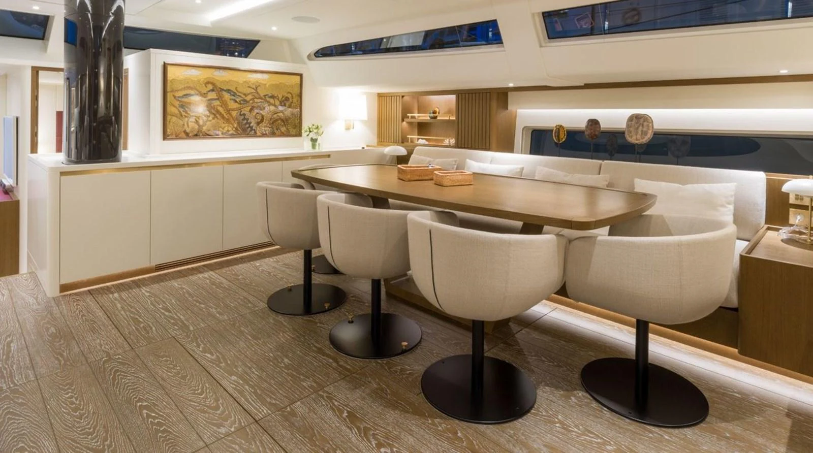 The yacht's dining area features a sleek, modern design with comfortable seating and elegant decor. aboard FANCY Yacht for Sale