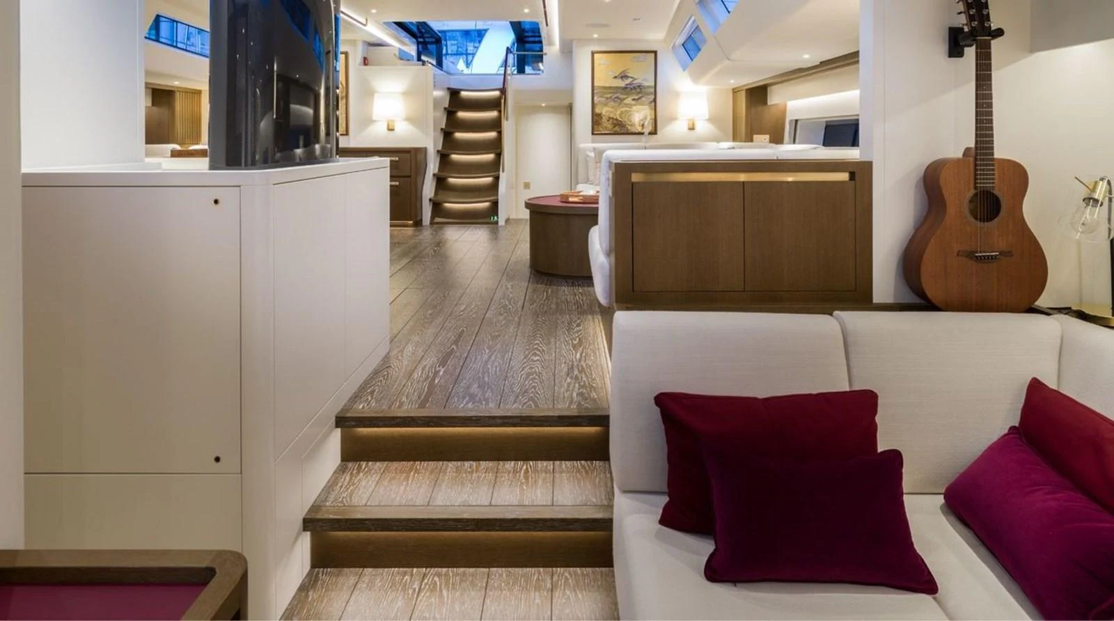 The yacht's interior features a cozy and modern living area with plush seating and stylish decor. aboard FANCY Yacht for Sale